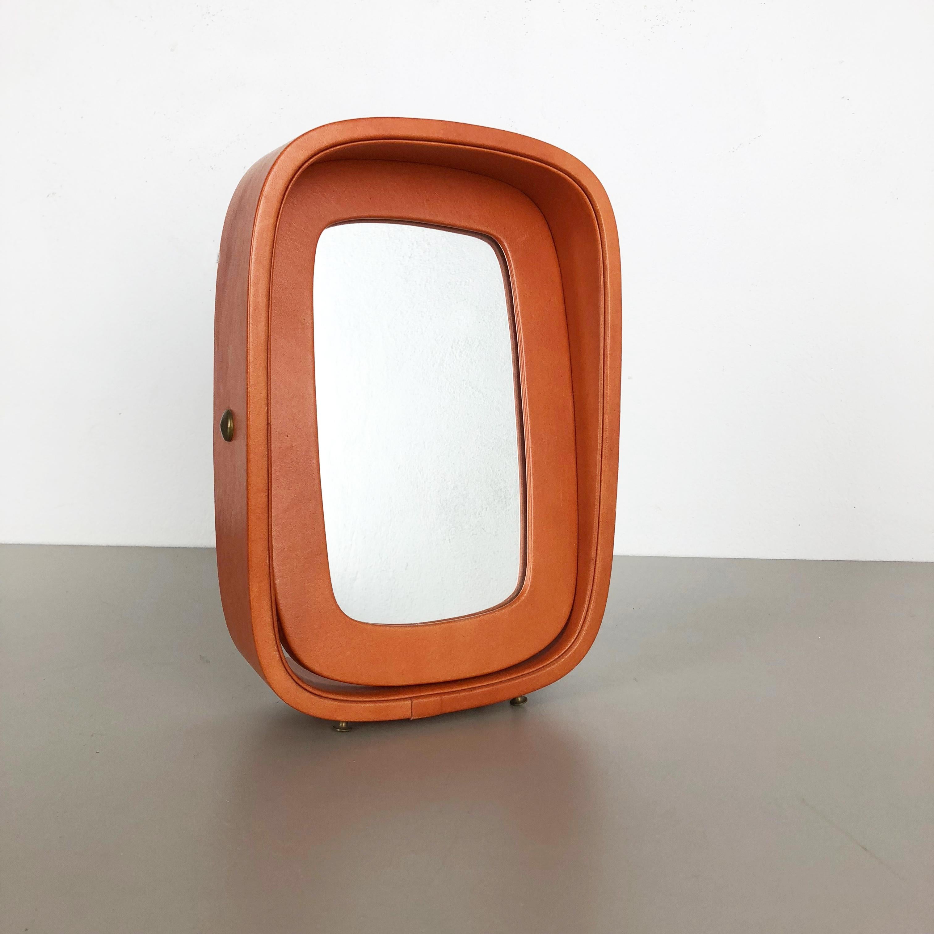 Article:

Table mirror


Producer:

Vereinigte Werkstätten München attrib.


Origin:

Germany


Material:

Wood, glass, leather


Decade:

1960s


Description:

This original midcentury table mirror was produced in the