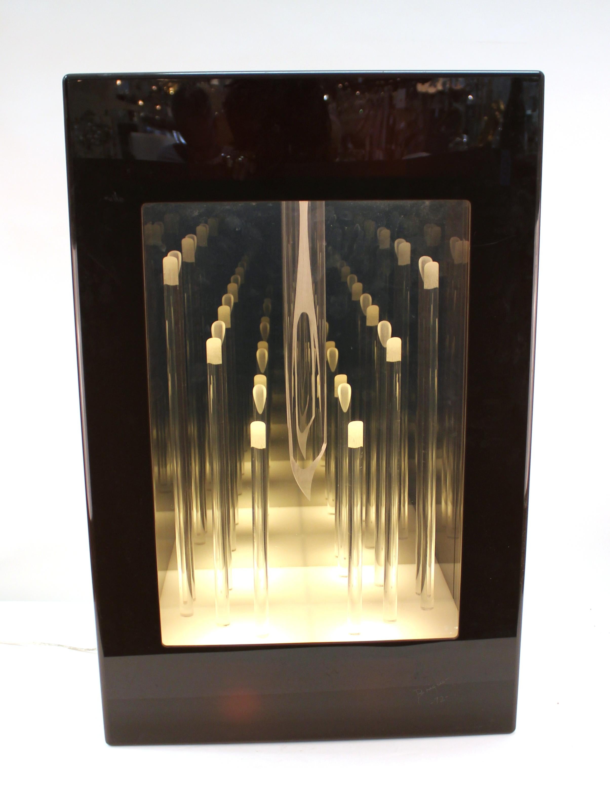 Modernist light box sculpture with interior depicting an abstract fireplace against an infinity mirror or candle-light when lit up. The piece is signed and dated 
