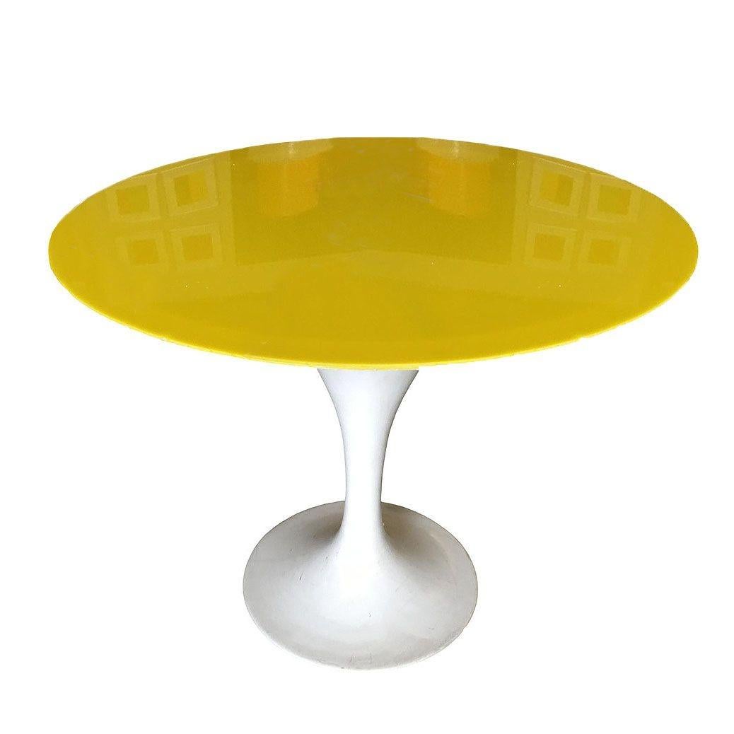 Rare light up midcentury table fashioned after the knoll tulip table. The table features a light-up table features a yellow acrylic top.