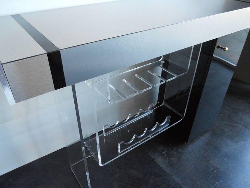 Modernist bar set (bar and 2 Lucite stools) in the style of Charles Hollis Jones
Under the platform there are lights and in the drawer there are lights
Measures: The bar itself 80