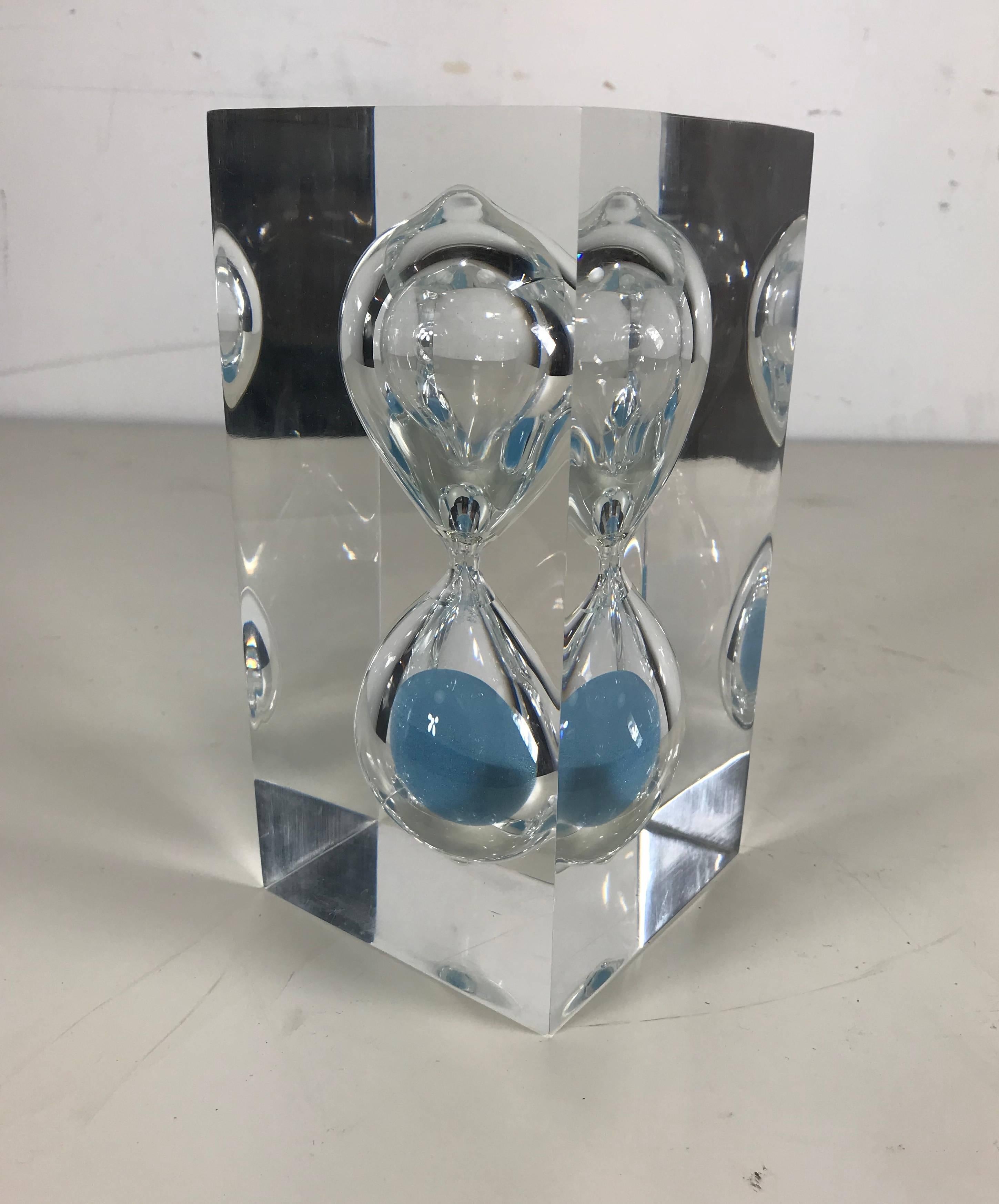 Modernist Lucite hourglass cube with ice blue sand. Beautiful object. Clear acrylic Lucite rectangular cube with hourglass interior, attributed to Franco Scuderi, Italy, 1970s.