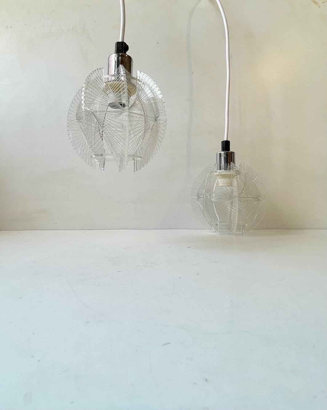 A pair of midcentury ceiling lights designed by Paul Secon and manufactured by Sompex in Germany during the 1960s or 70s. They feature Lucite frames and has Nylon wires woven all around for a dramatic, graphic lighting effect. The price is for the