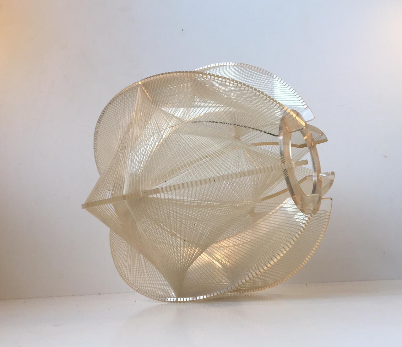 Graphic midcentury ceiling lamp designed by Paul Secon and manufactured by Sompex in Germany during the 1960s. It features a Lucite frame and has Nylon wires woven all around for a dramatic, graphic lighting effect.

 