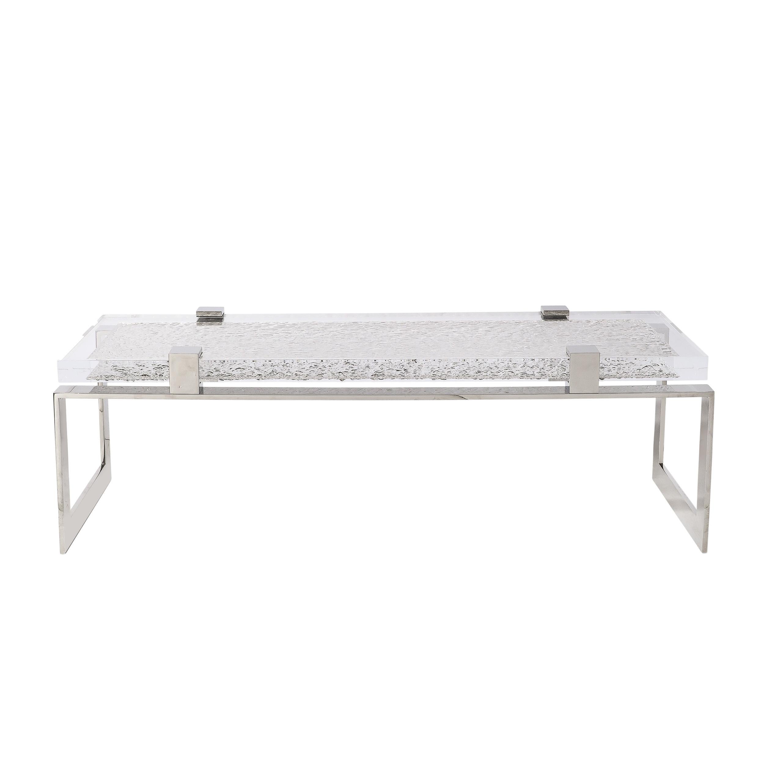 This Modernist nickel  and Lucite Chipped Block Cocktail Table by Lorin Marsh originates from the United States during the late 20th Century. Featuring a long rectangular composition in bands of polished nickel with a stunning lucite top surface