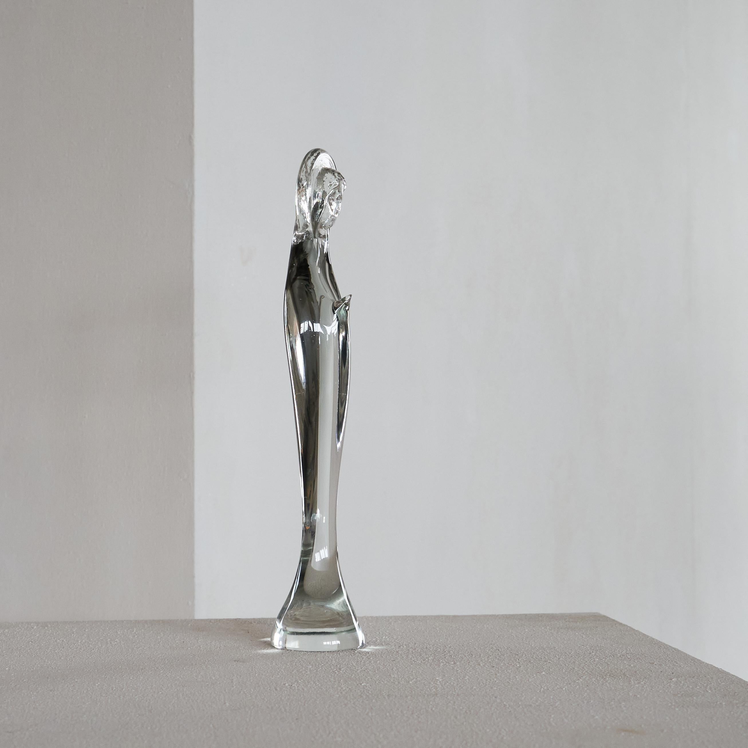 Modernist Madonna in Art Glass 1960s.

This is a wonderful and poignantly beautiful mid-century modernist Madonna in art glass with great details. Catches the light in a very beautiful way and the modernist design really shines trough when placed