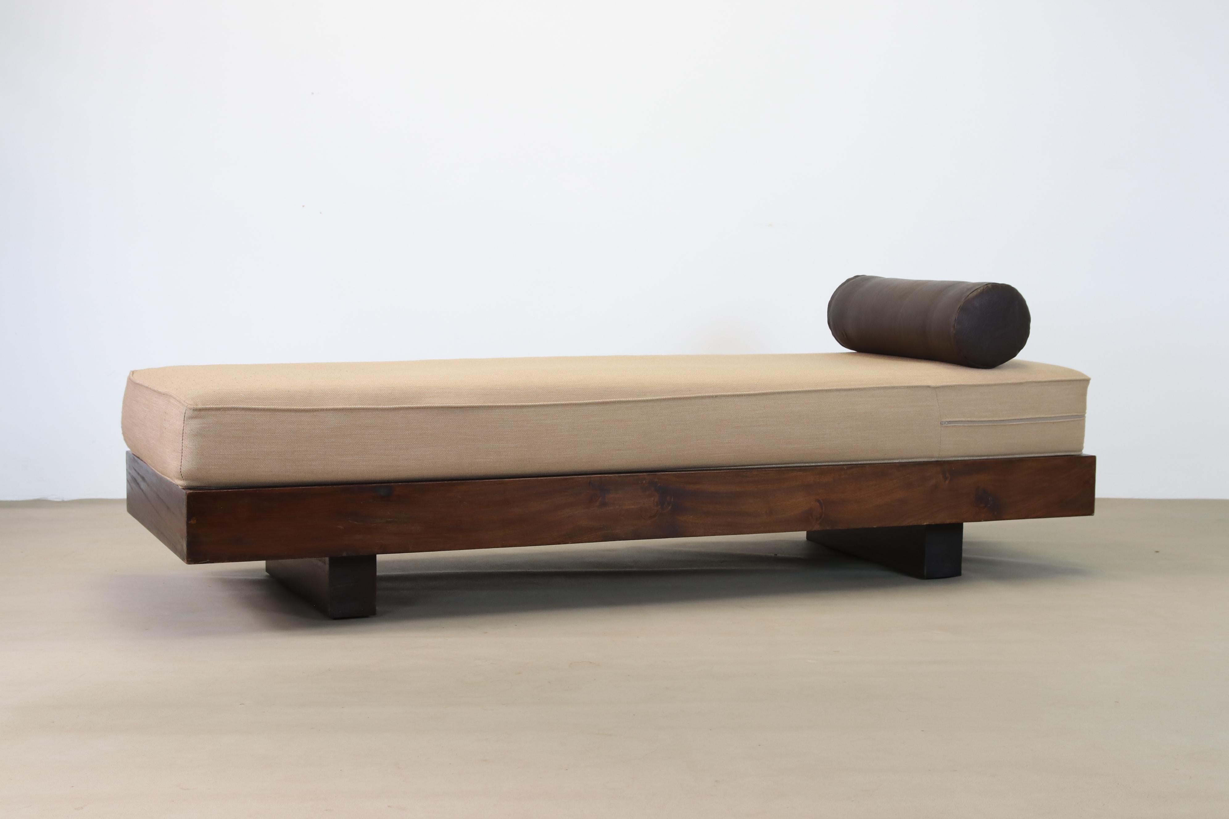 Mahogany daybed in the style of Jean Prouve, Charlotte Perriand and Le Corbusier.
Made from solid mahogany wood. The modernist designed daybed has an upholstered mattress with inner springs and a round brown leather cushion. Beautifully simplistic