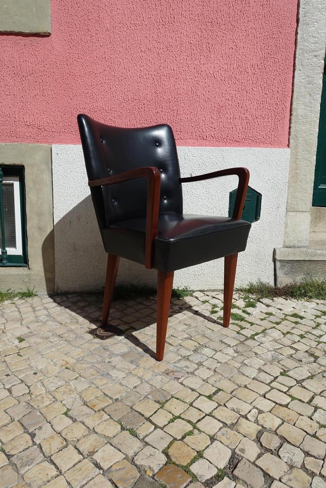 This Paris model armchair was designed by José Espinho for Olaio produced in Portugal in the 1960s.
Made from Mahogany wood and faux leather.
 