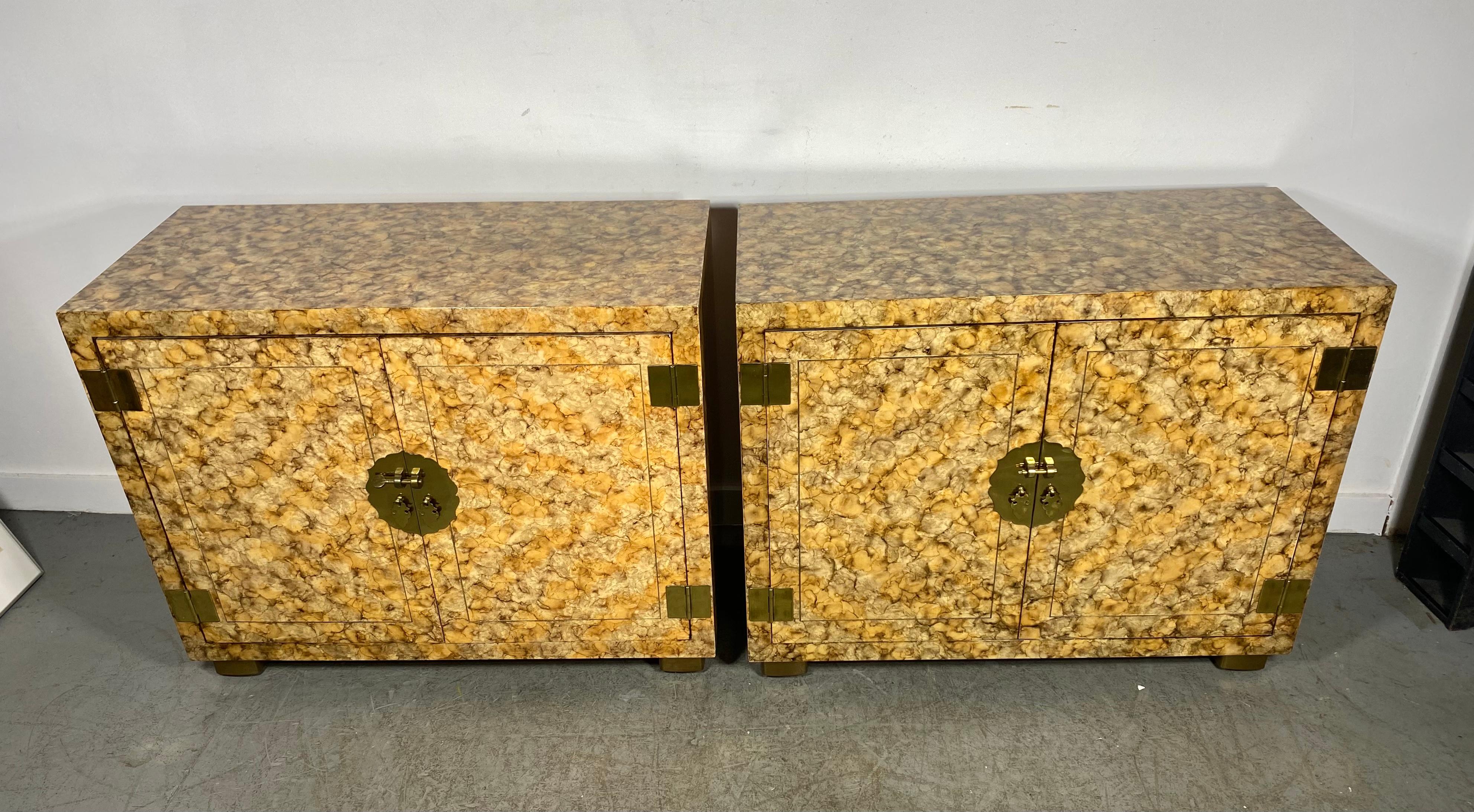 Modernist Matched Pair Asian inspired Faux Tortoise & Brass Cabinets made by Henredon Fine Furniture.. , Wonderful original finish ,patina.. featuring two doors with asian inspired brass hardware as well as stunning brass flat hinge detail and brass