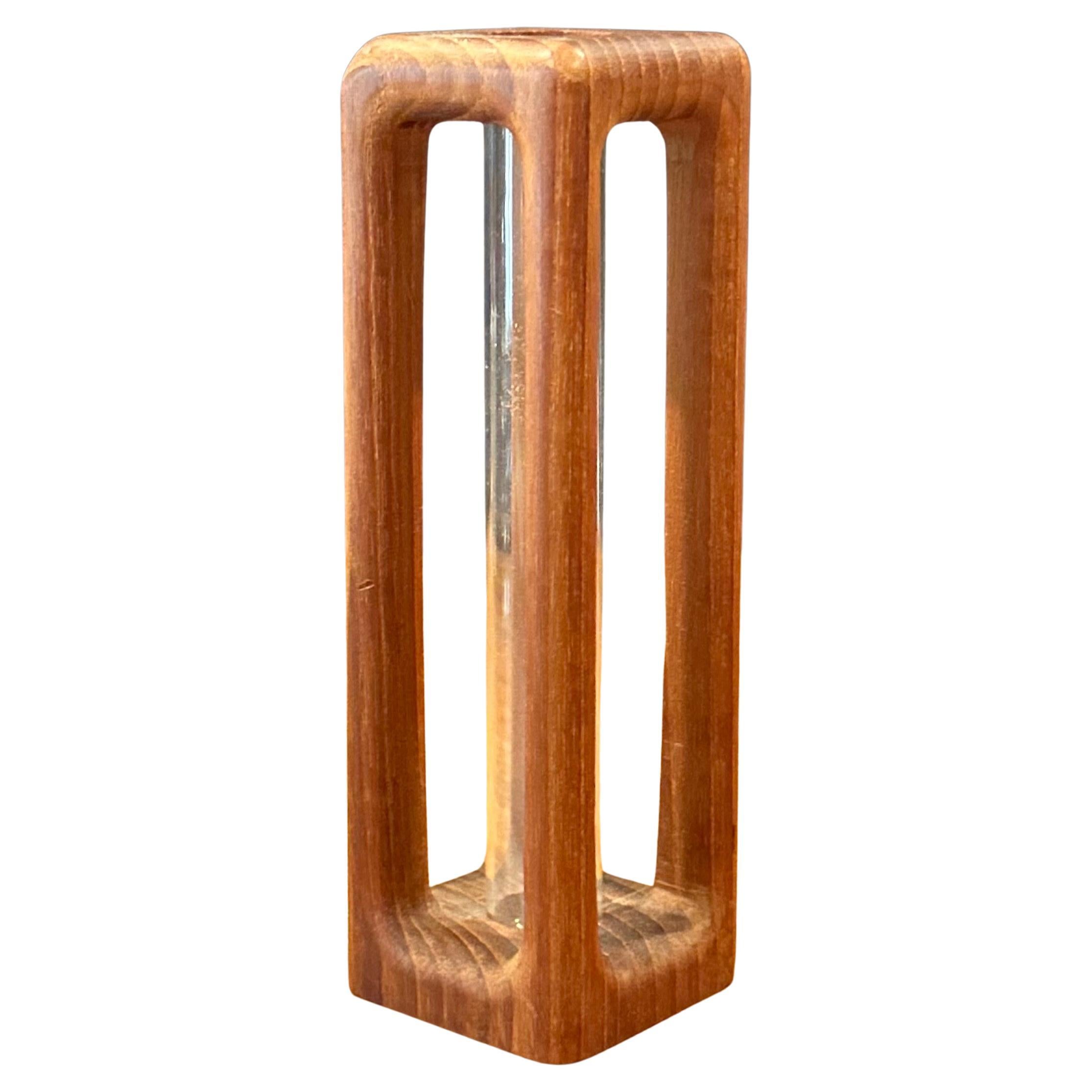 A really cool modernist MCM solid teak and glass cylinder bud vase, circa the 1970s. The vase is in very good vintage condition and measures 2