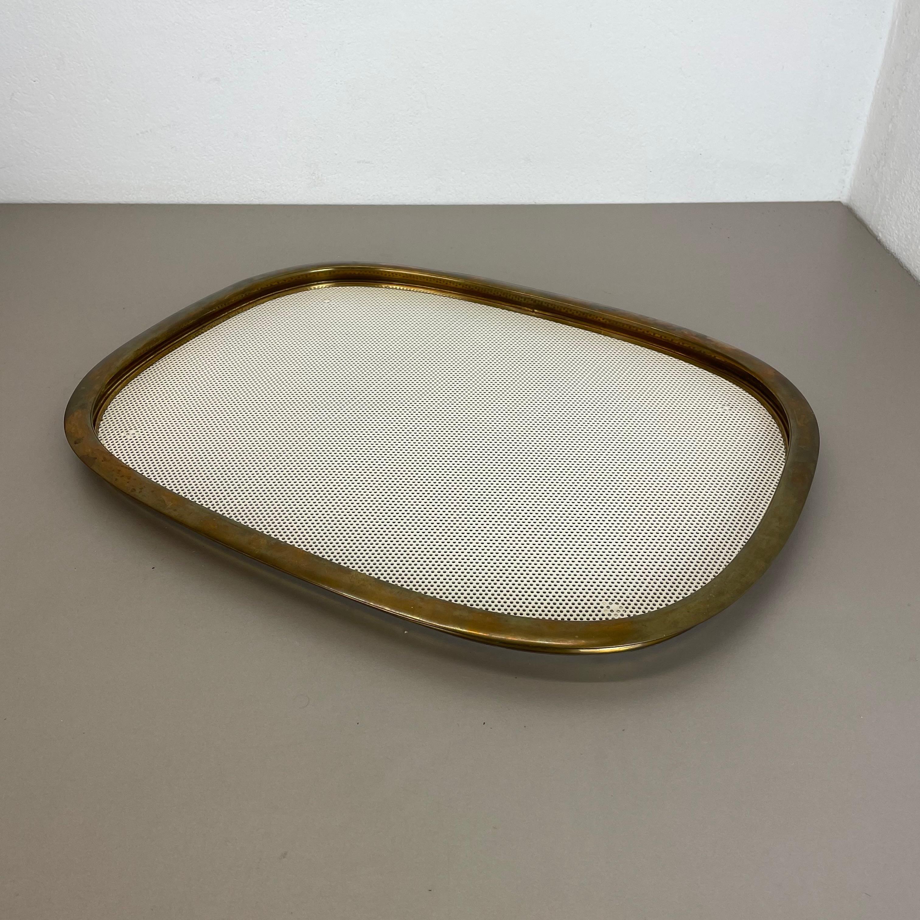 Article:

Tray element with hole pattern


Producer:

Vereinigte Werkstätten München


Origin:

Germany


Material:

metal and brass


Decade:

1960s


Description:

This original midcentury tray element was produced in the 1960s in Germany by the