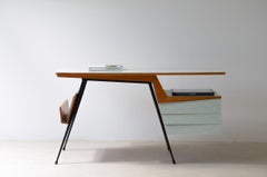 Modernist metal and wood desk with methacrylate-covered top