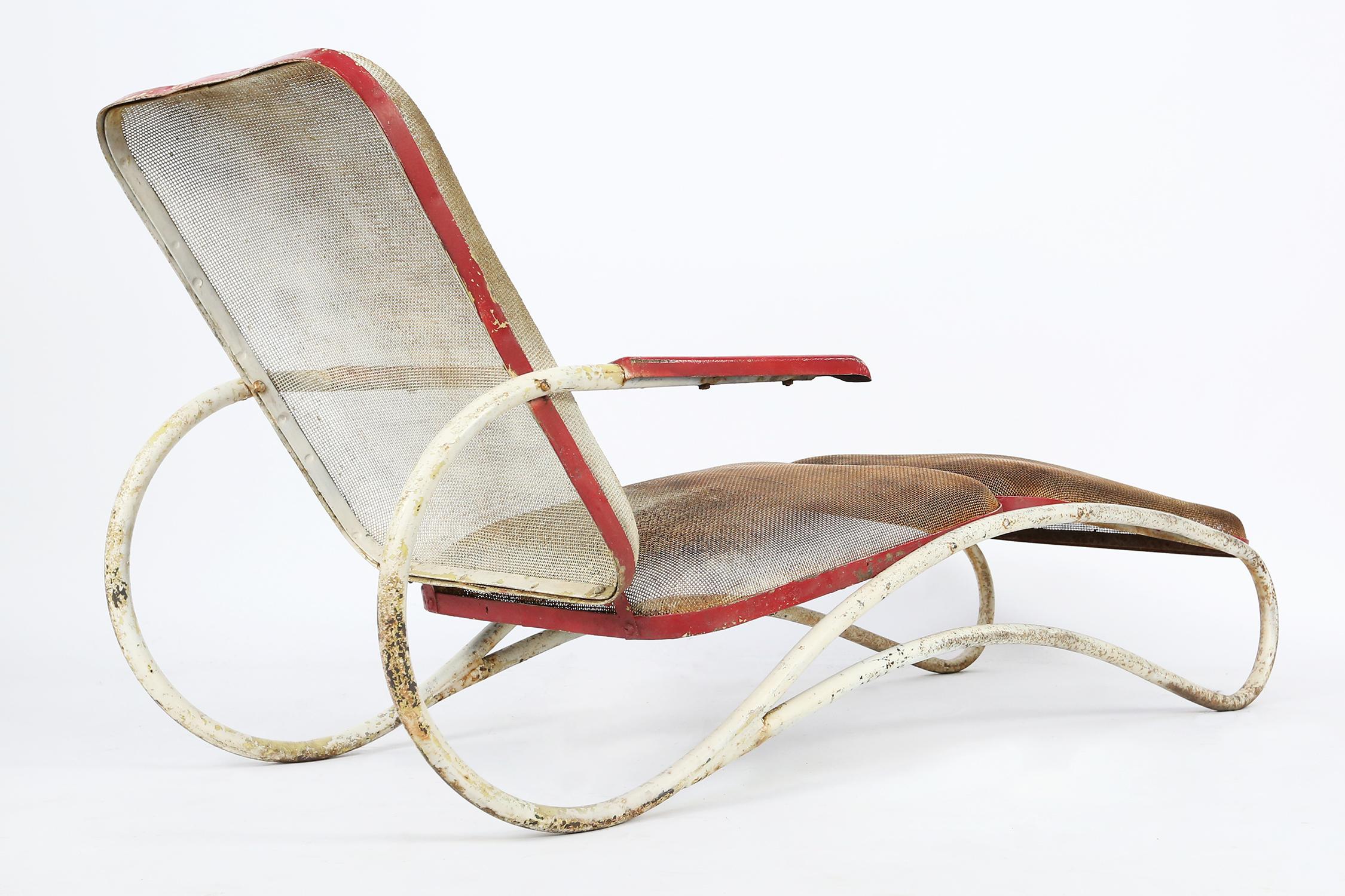 This 1940s American Art Deco chaise lounge is a machine age symphony in white and red. Constructed of tubular metal and perforated metal seat pads.