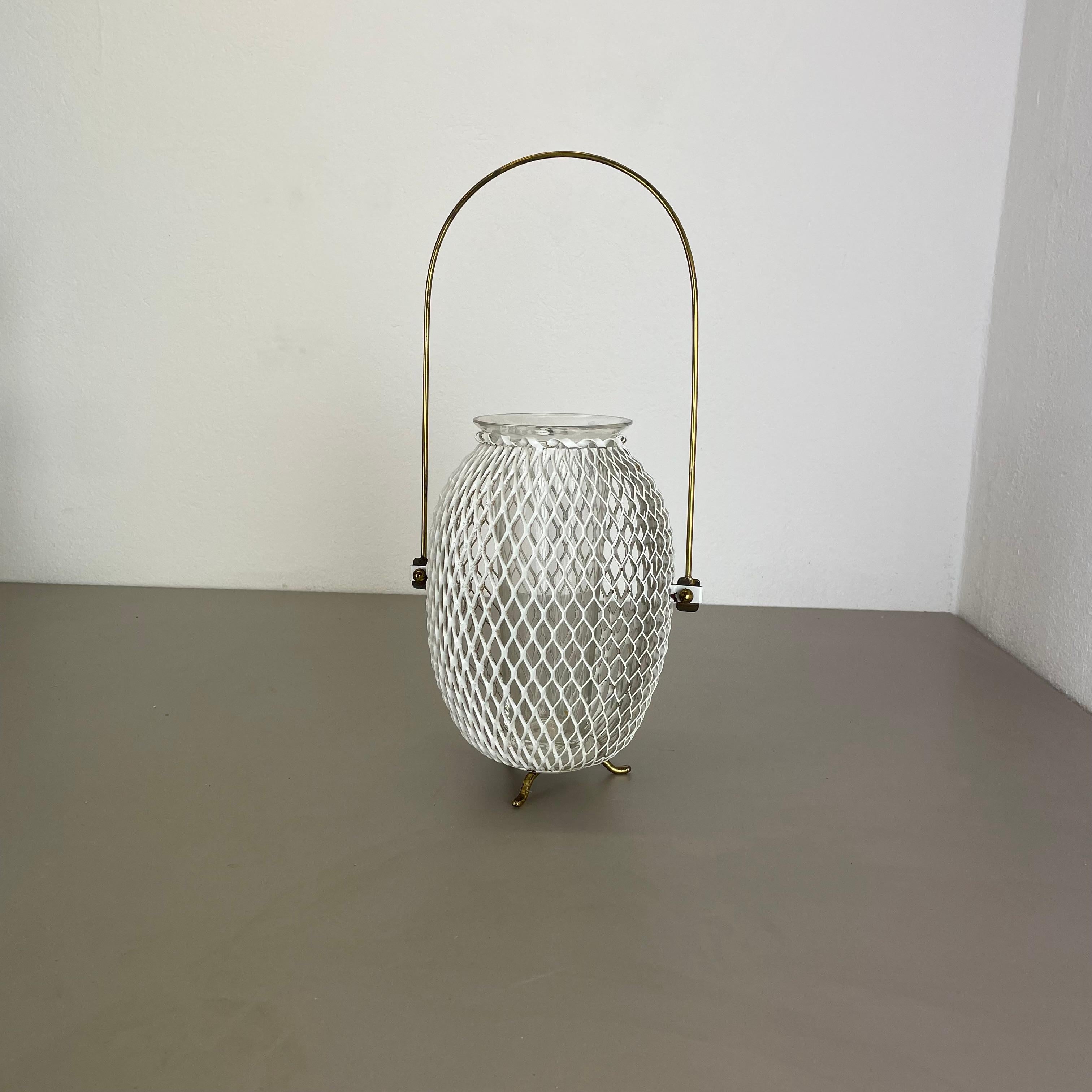 Article:

modernist metal planter vase element


Description:

This original modernist planter vase element vase was produced in the 1950s in France. It is made of white lacquered metal with a round brass handle at the top. the pot has a glass vase