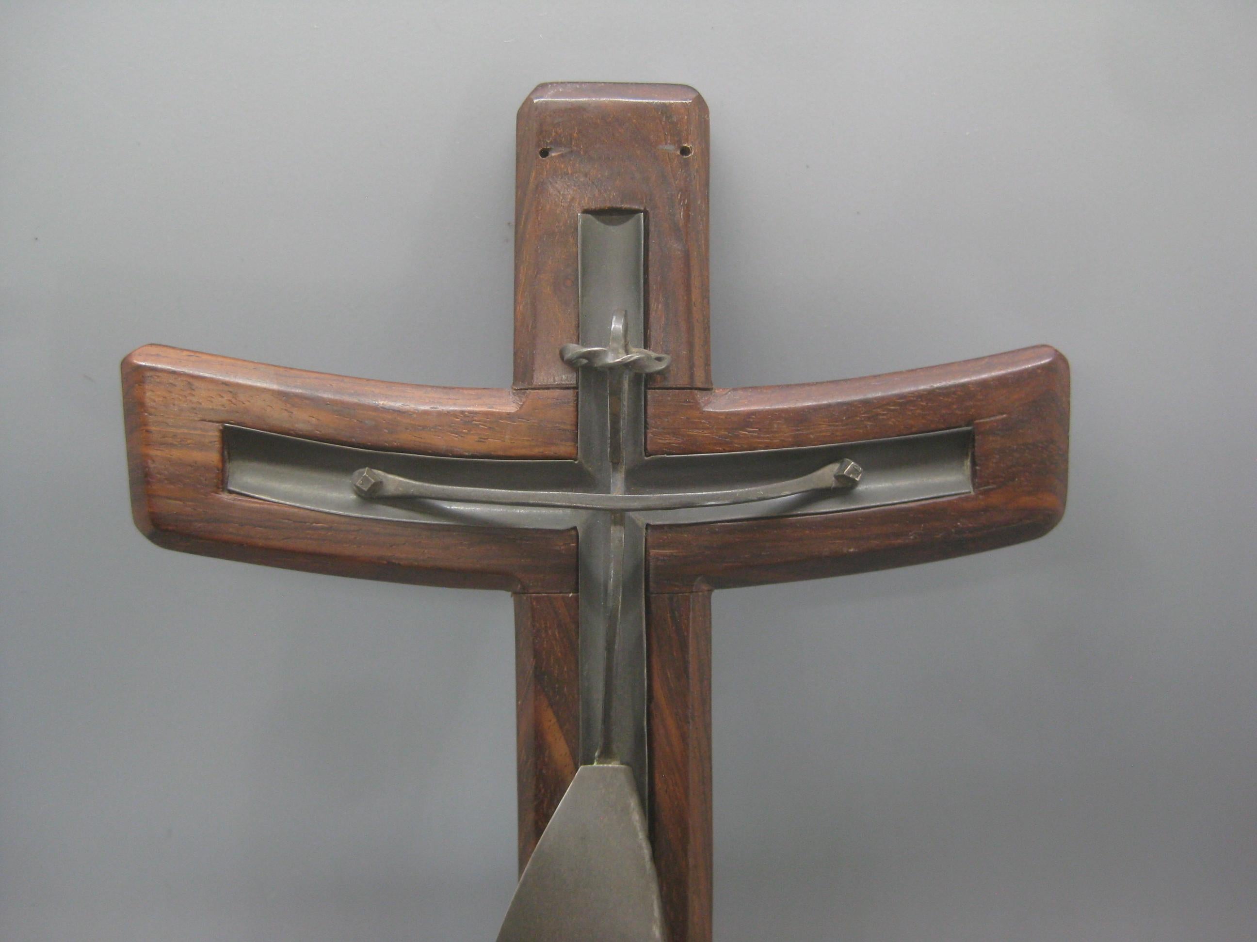 Hand crafted Modernist sterling silver on rosewood wood crucifix cross, circa 1950's. Made in Taxco, Mexico and has the artist initials(MH) on the back tag. Wonderful abstract modernist design and form. Displays well. The sterling piece can be