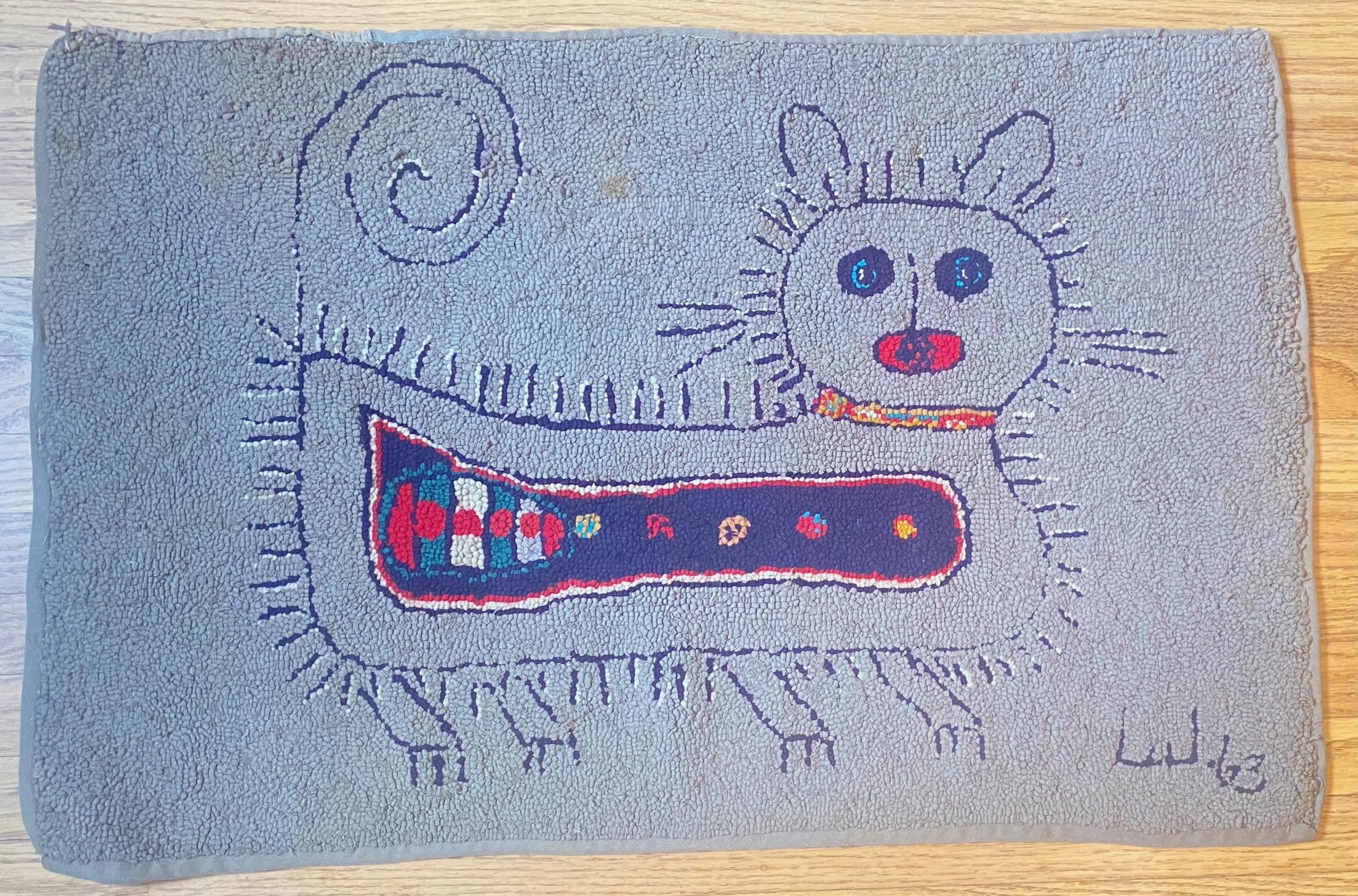 Perfectly charming Folk Art small wool rug or wall hanging of a modernist style cat.
There is some minor staining, and a few lose loops and minor repair on edges.
Signed and dated '63.
American  