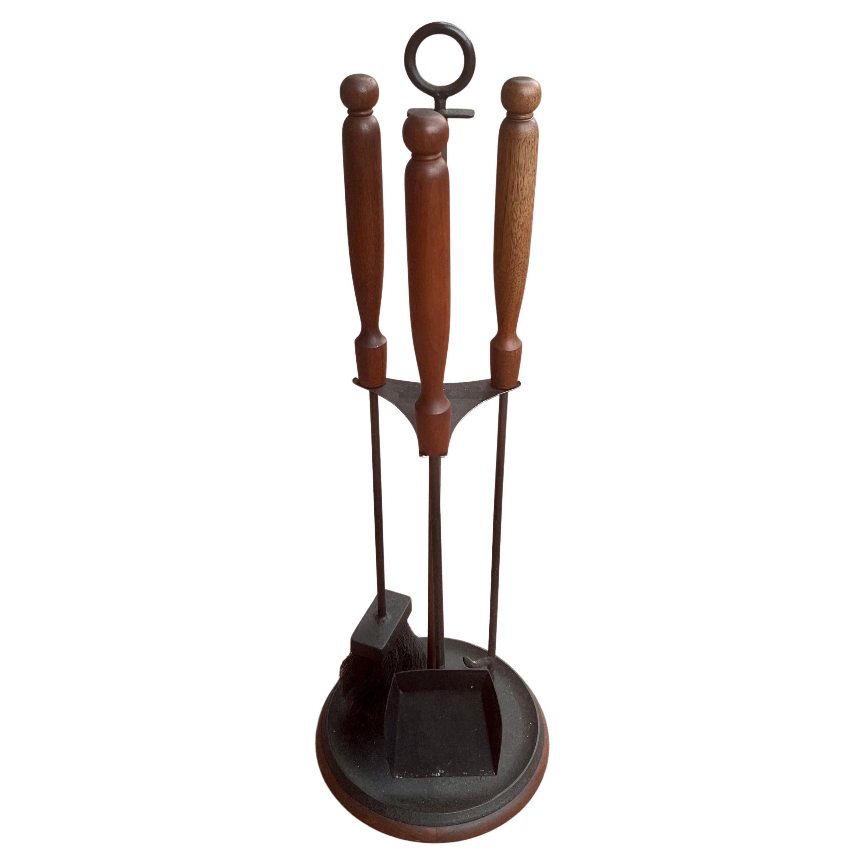 Striking rare solid walnut and iron combo, on these rare fireplace tools set the very unique base with solid walnut bottom, circa 1950s.