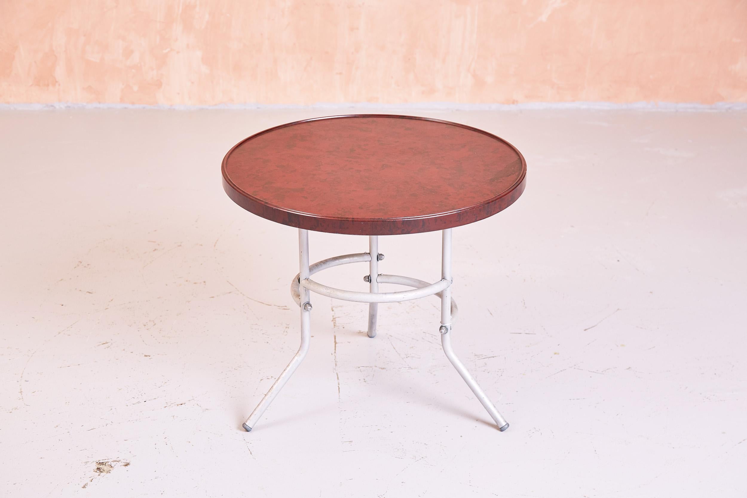 British bakelite topped side table with chrome steel base.
Produced in the 1940s, this modernist design was manufactured by Mahbro
 