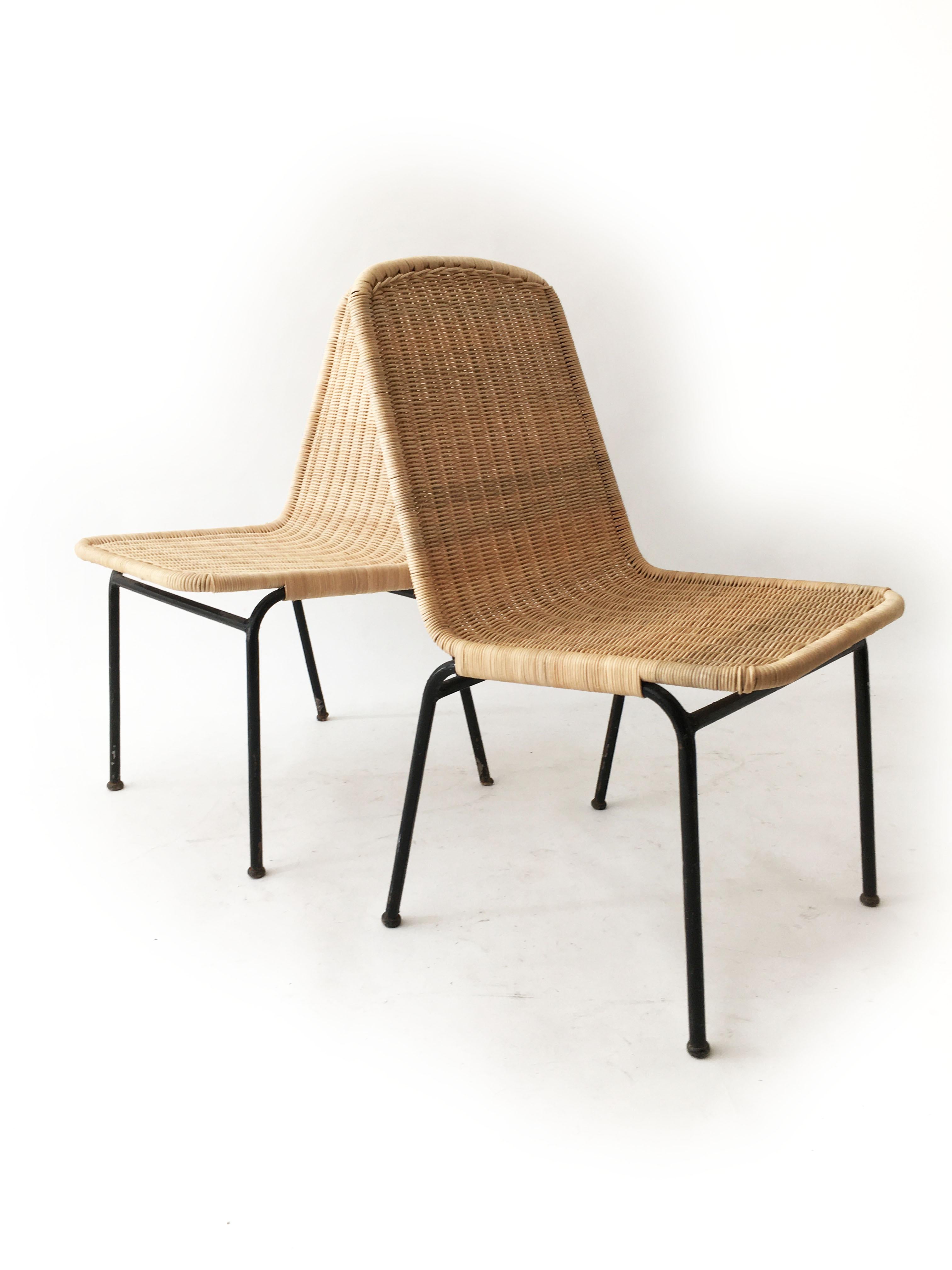 Fine pair of modernist midcentury wicker and iron chairs. This is a rare set of two from Austria 1950s. We renewed the wicker seats and backrests to refresh the beautifully sculpted organic shape. Great to be placed as occasional chairs in the