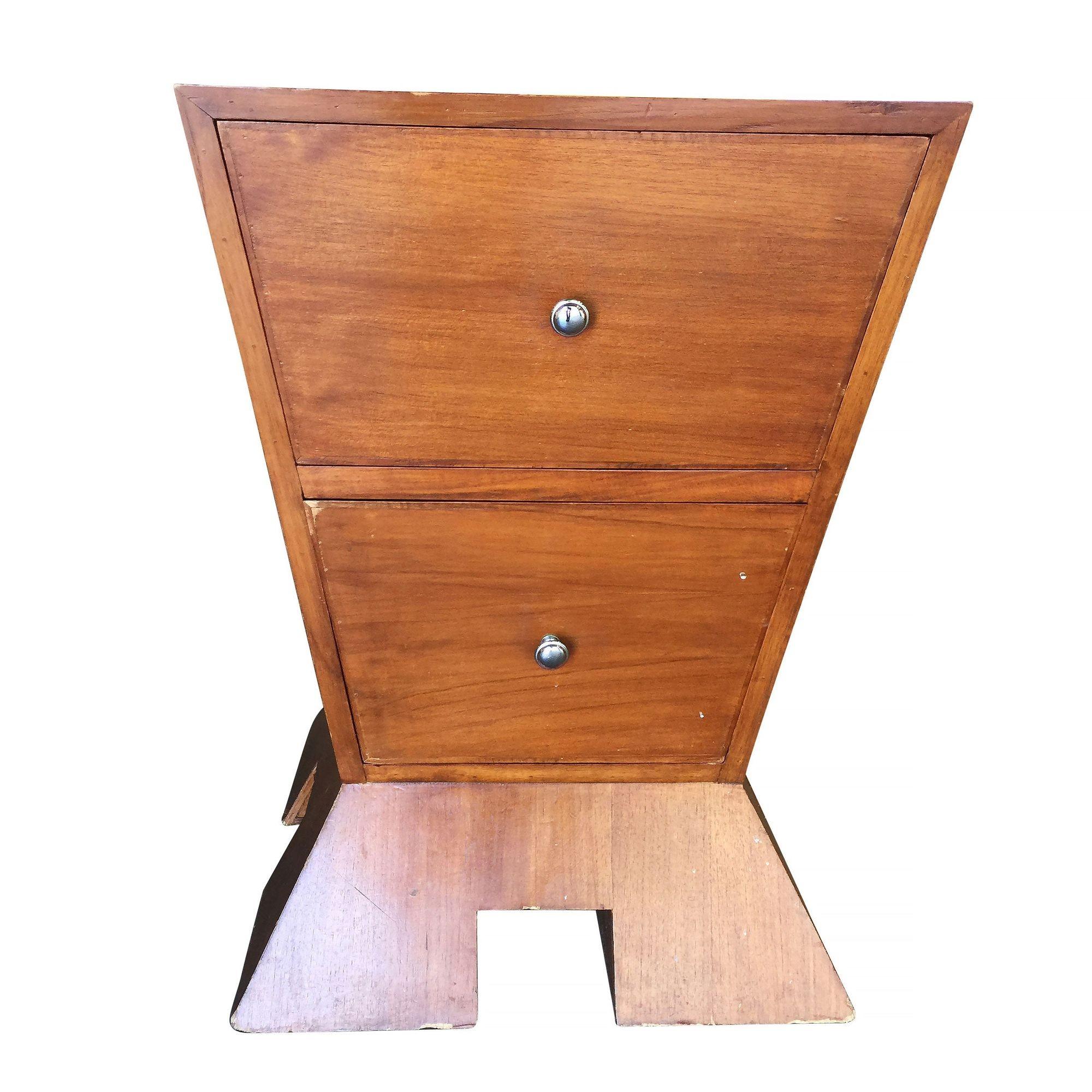 This avant-garde nightstand redefines modernism with its striking inverted triangle design resting atop a triangular base. Equipped with two drawers adorned with sleek round pulls, it seamlessly combines functionality with cutting-edge aesthetics,