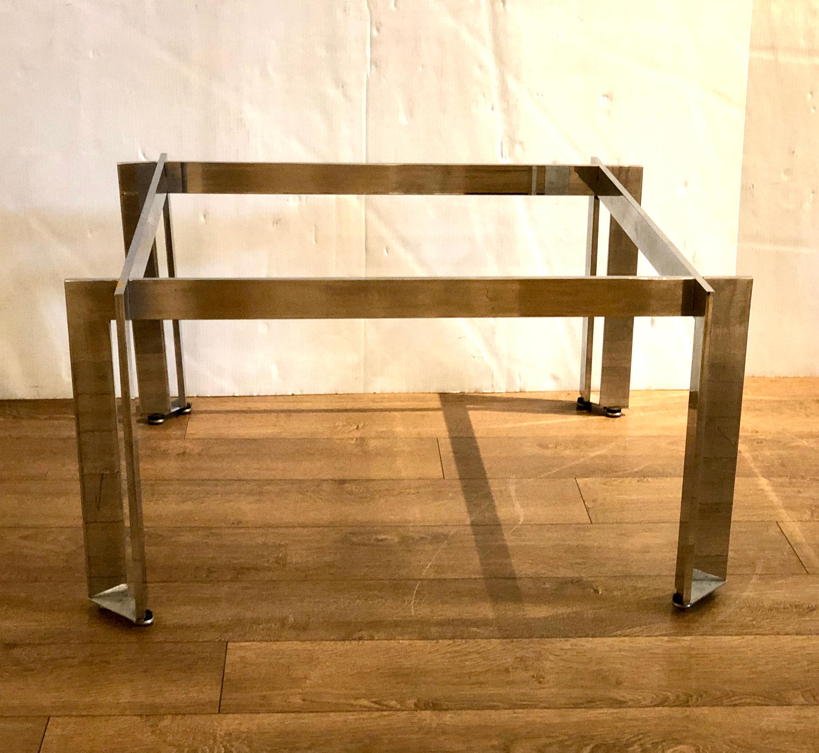 Incredible craftsmanship in this solid steel square coffee table with chrome polished finish, circa 1970s. We are selling the table without top it can have a glass or a marble top whatever your choice, its solid sturdy we polished the piece looks