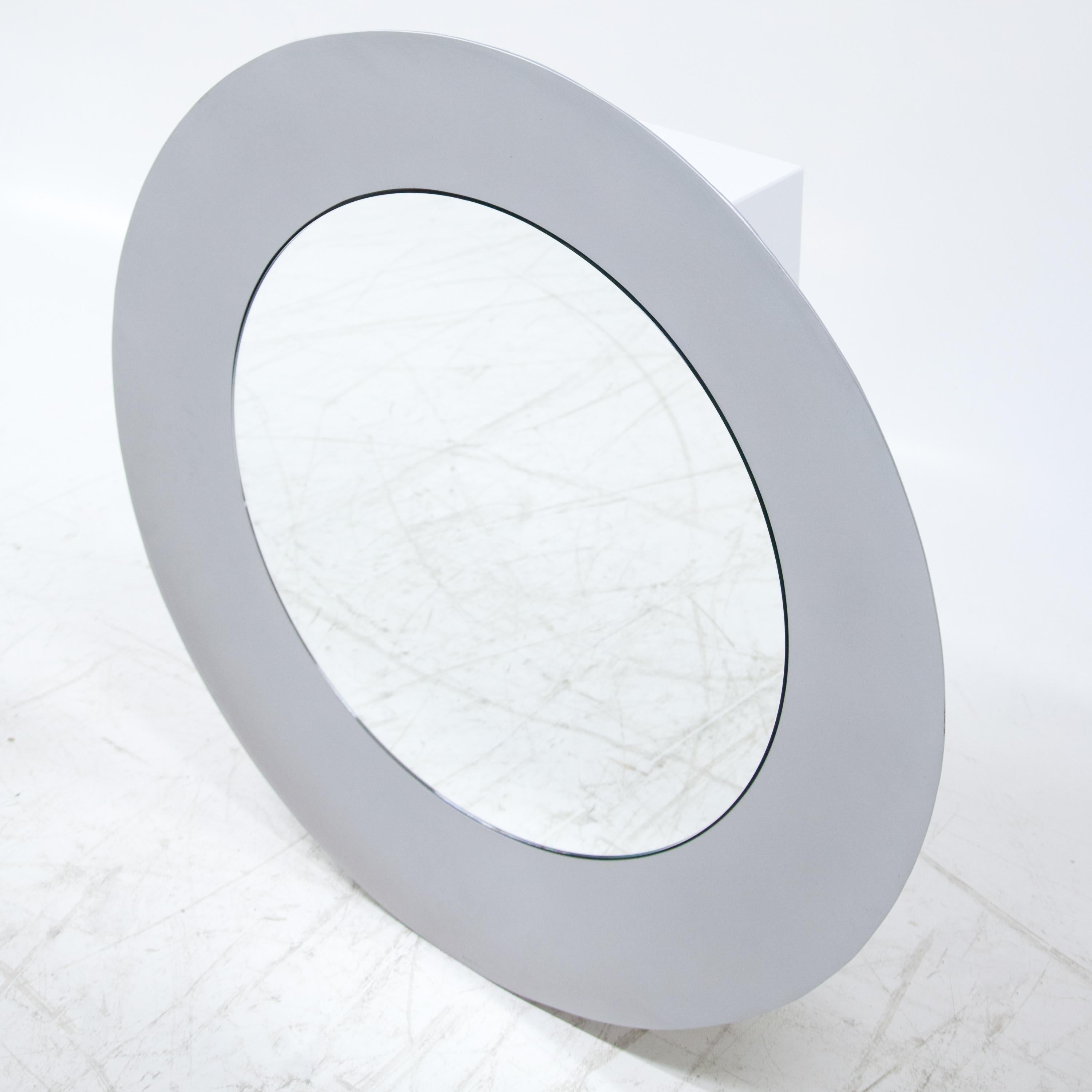 A sculptural Modernist mirror 
by artist Lorenzo Burchiellaro.
Textured cast aluminum 
with a slightly concave shape. 
Signed on the bottom Burchiellaro. 
  