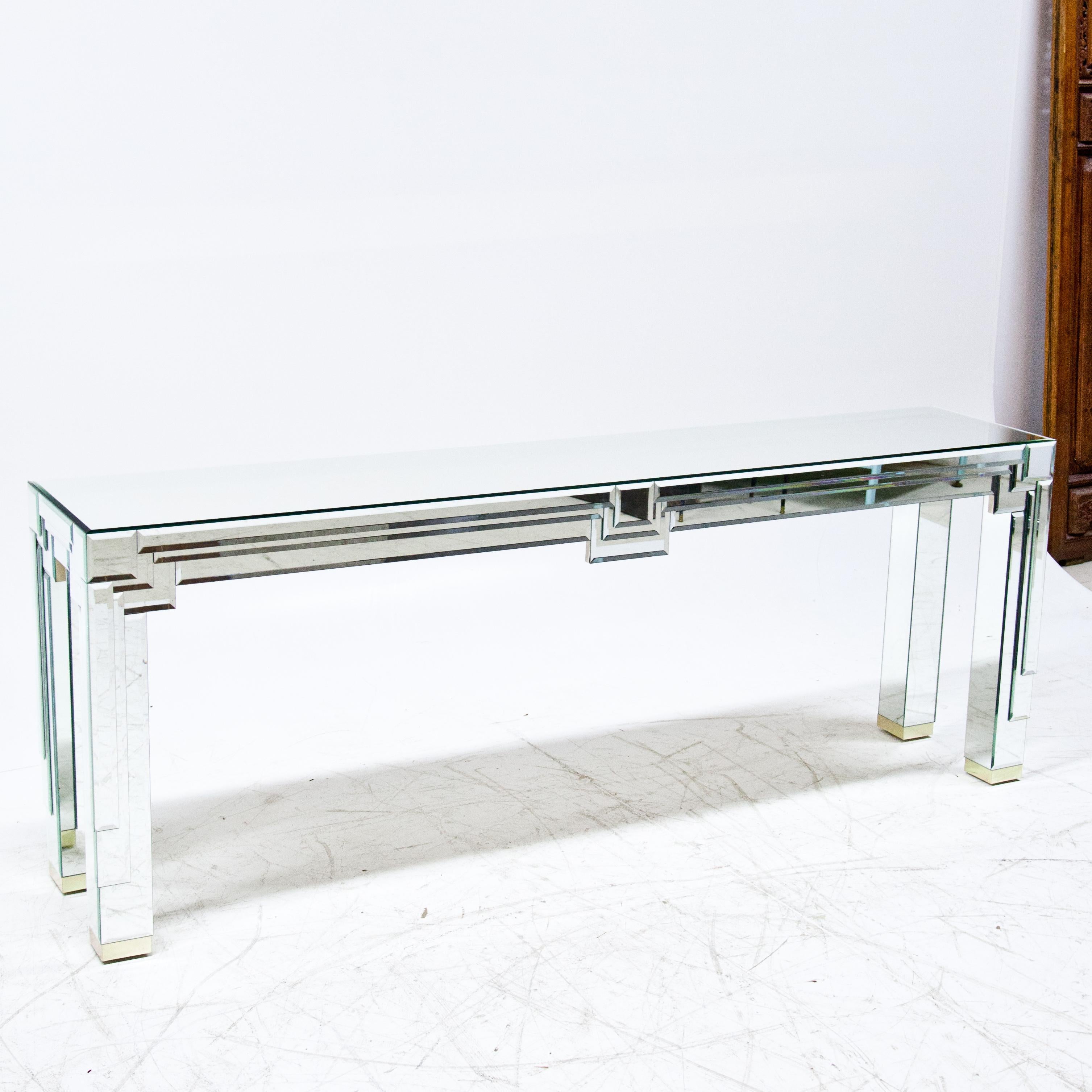 Long modernist mirrored console with layer mirrored details.