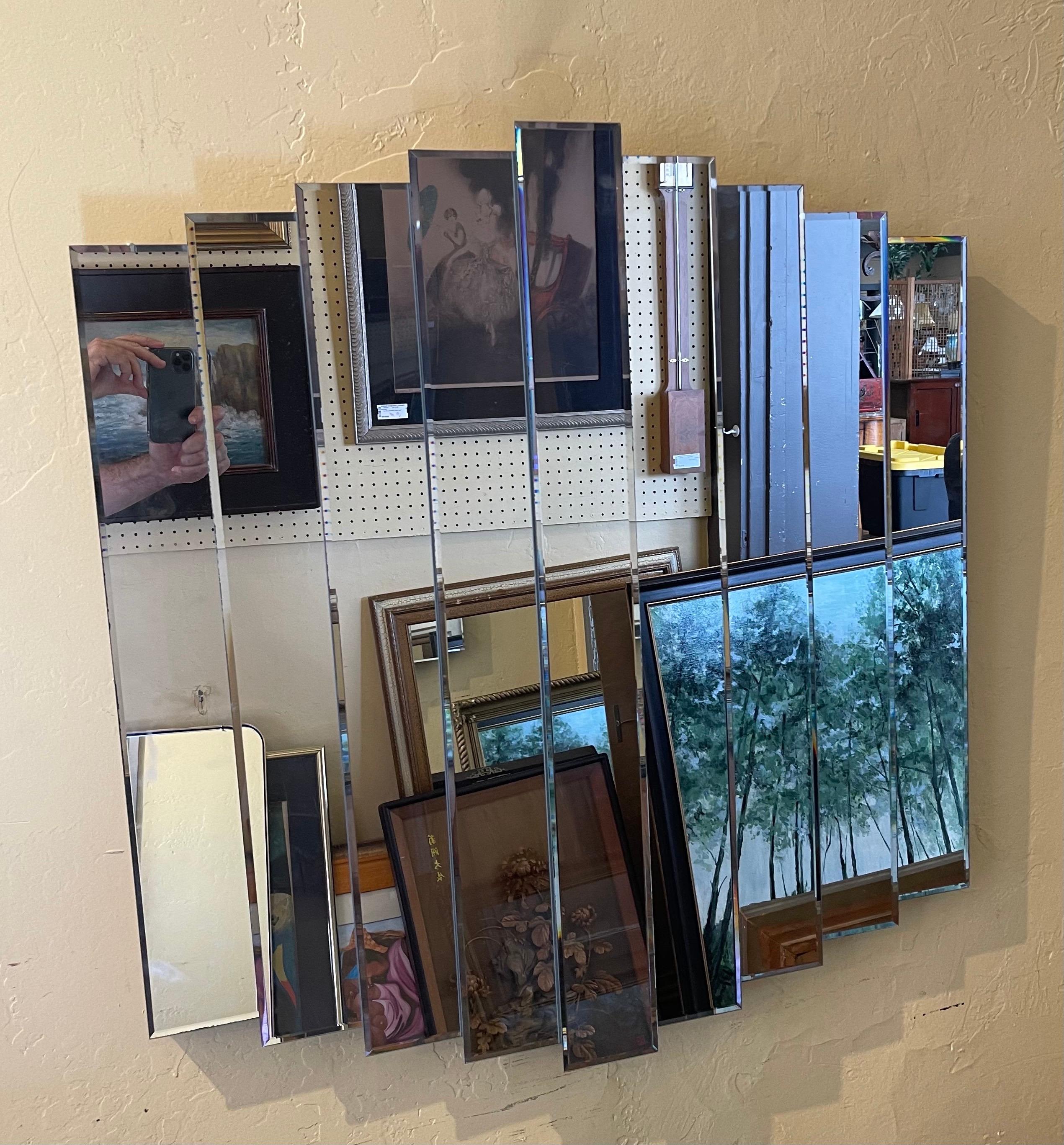 Modernist multi-level large decorative nine panel wall mirror, circa 1980s. The mirror is in great condition with and measures 36
