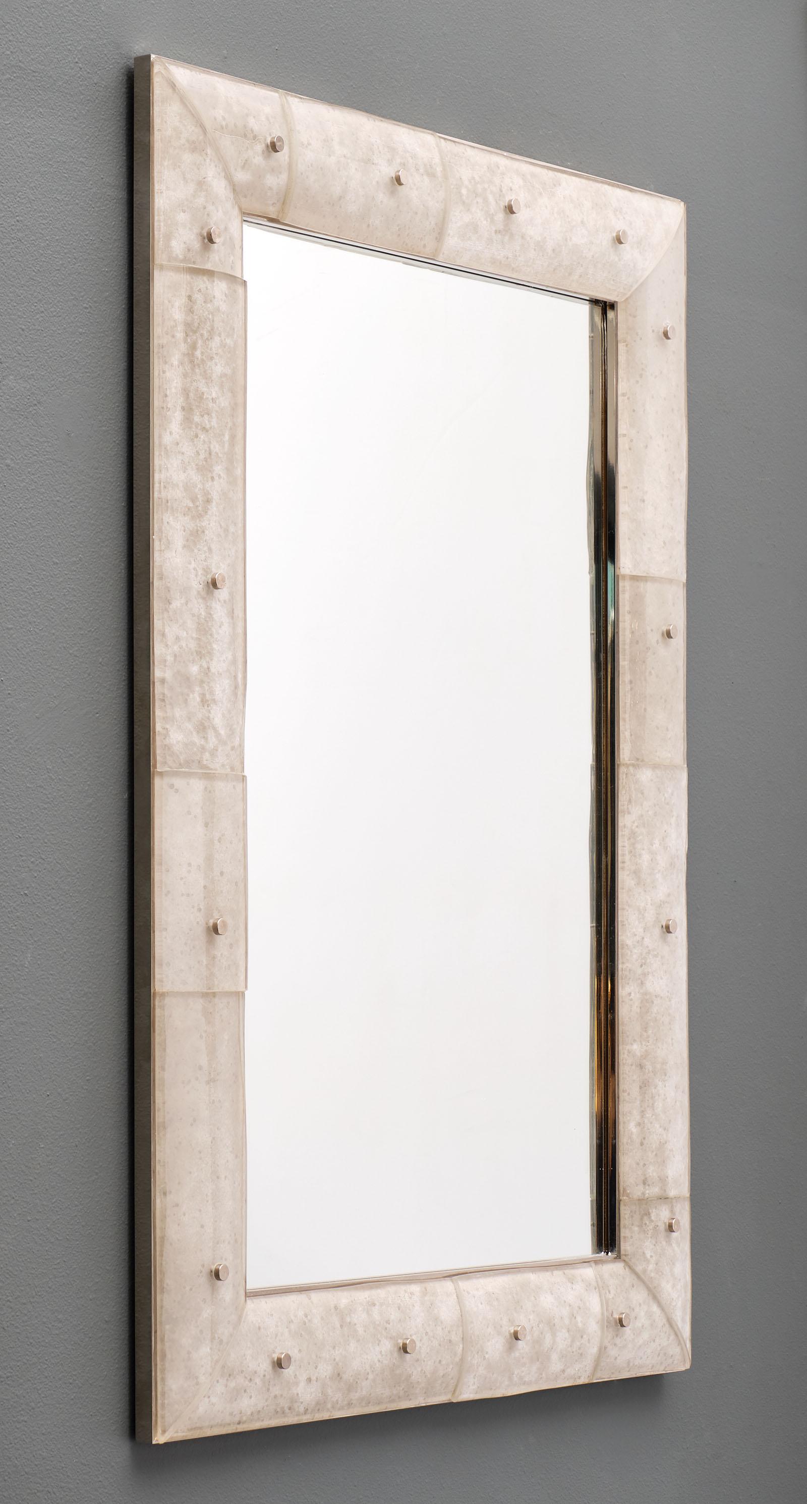 A pair of Murano glass modernist mirrors featuring multiple hand-blown components of textured and smoked glass that form the frames. They are held in place by the chrome structures. We love the organic feel of the glass.