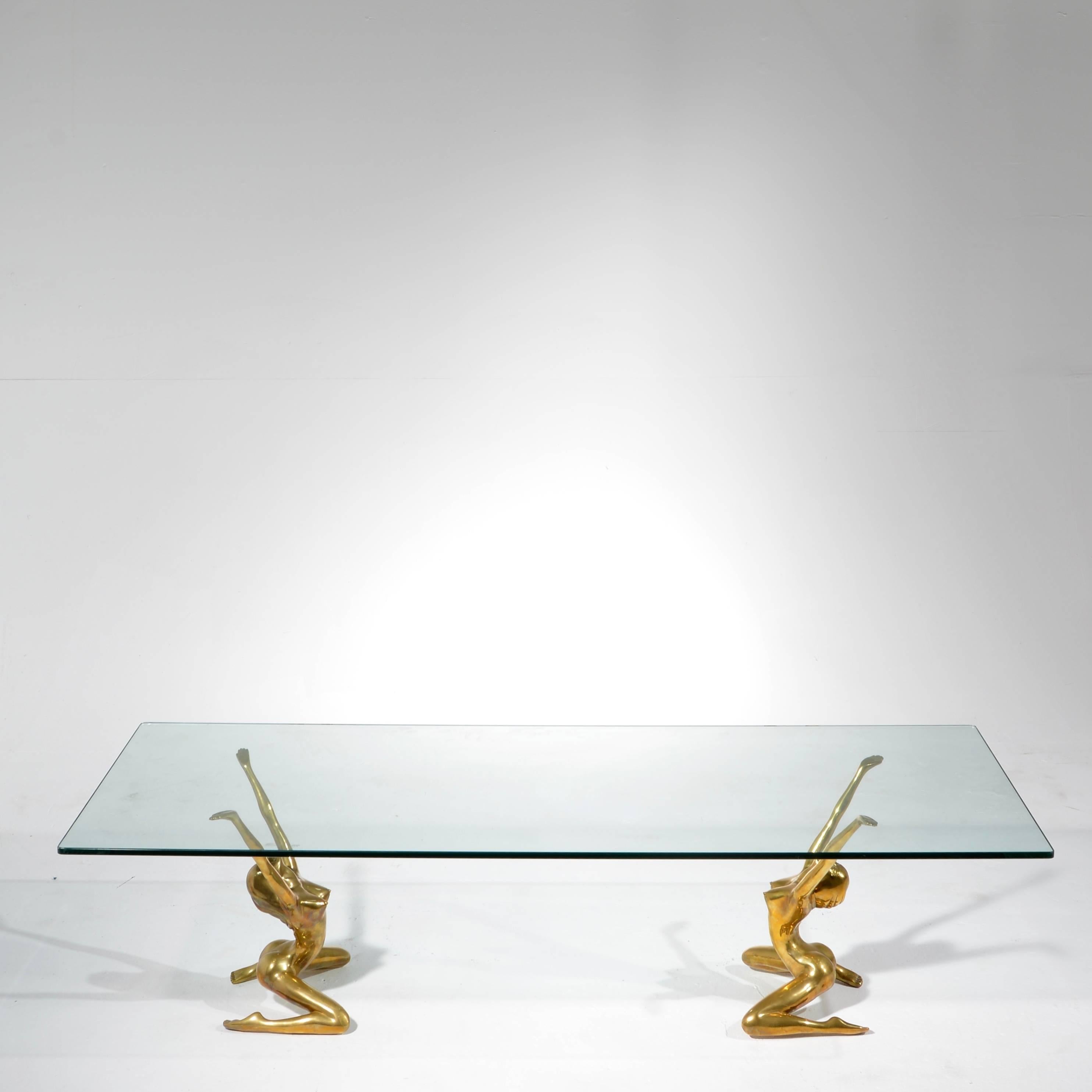 This is an amazing modernist table in cast brass. The basses can be used with many different shapes of glass table tops.