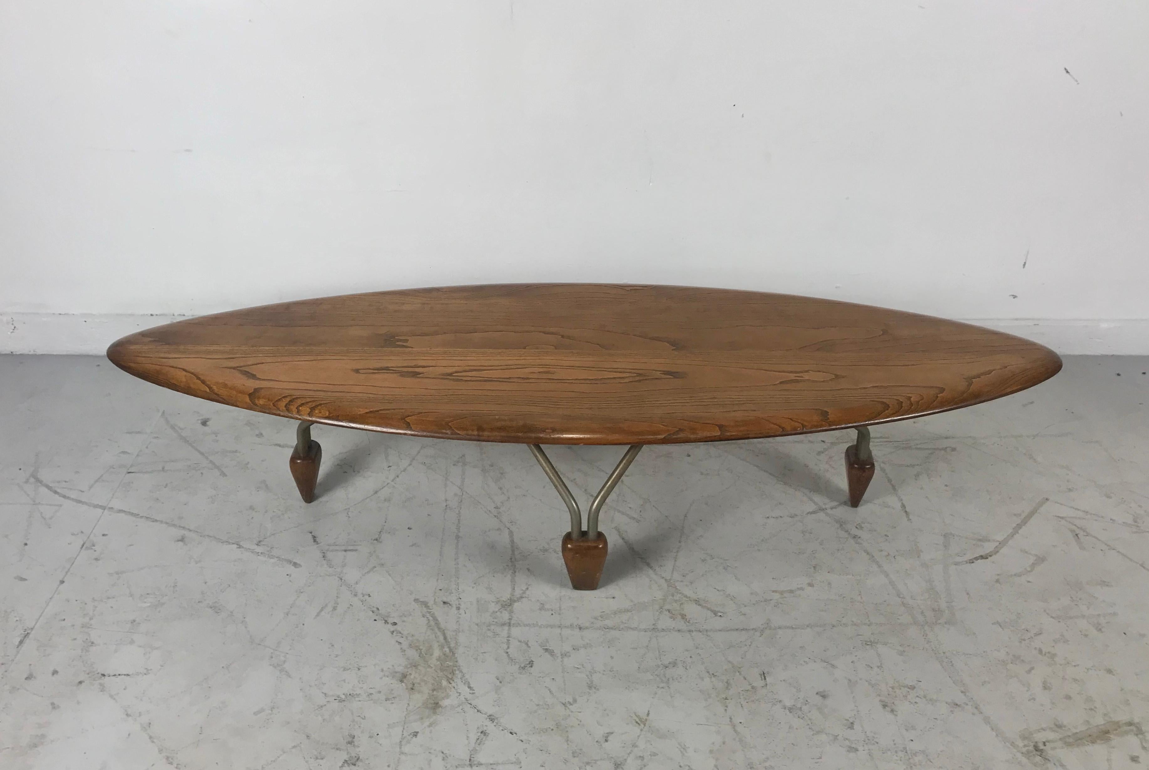 Modernist oak and aluminum surfboard coffee/cocktail table, attributed John Keal. Truly a piece of art, sculpture. Solid. Beautifully grained oak beveled surfboard top, aluminum hair-pin legs with oak 