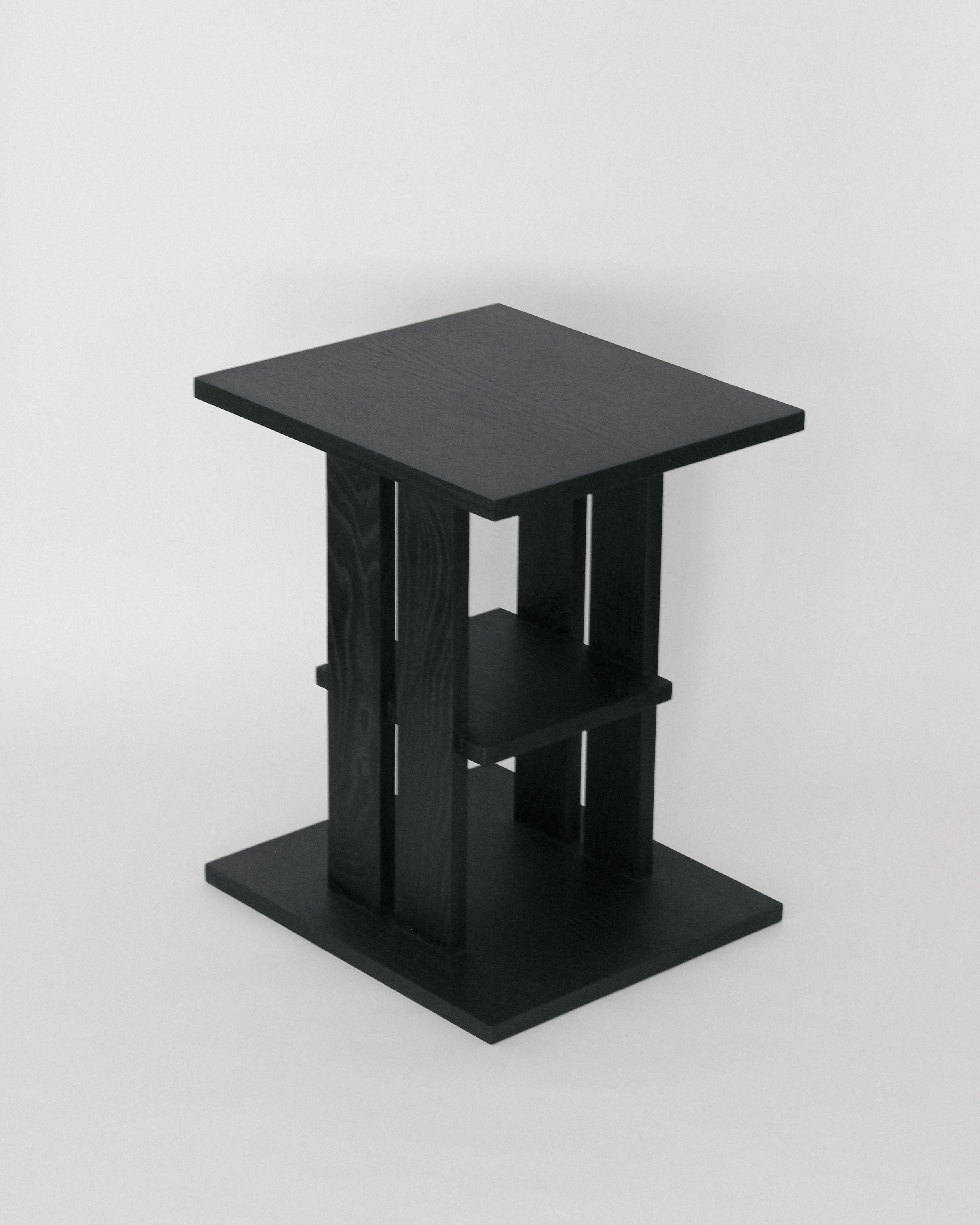 Modernist side table handmade in Oak with an ebonized black finish. Made in Los Angeles by expert craftsmen, and designed by Christian Sanchez. 

This table draws inspiration from modernist furniture of the 1950's, and is defined by clean lines and