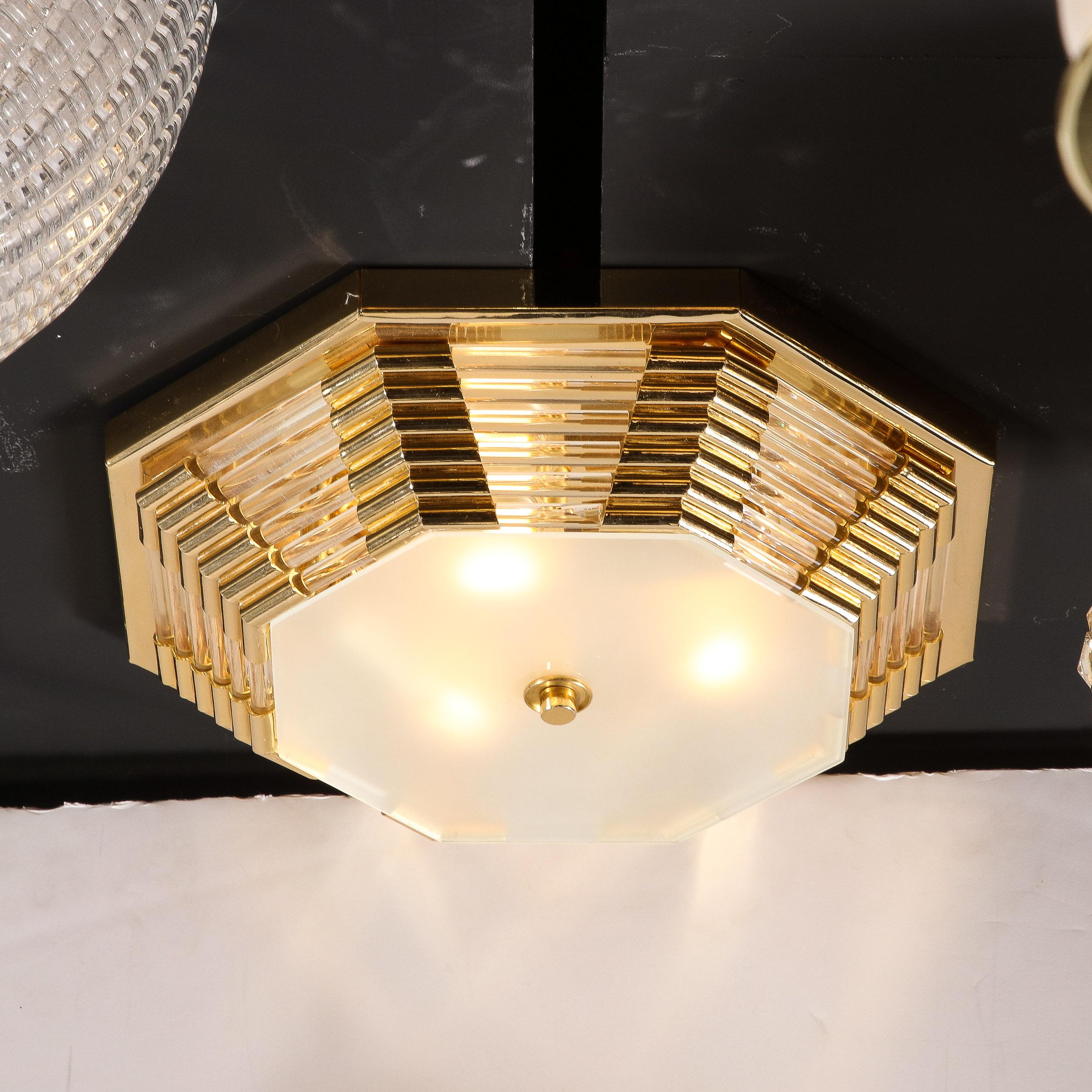 This Modernist Octagonal Brass w/ Glass Rods & Frosted Shade Flush Mount Chandelier originates from the Italy, Circa 1980. Featuring a tiered a geometric design, composed in brass with glass rod detailing and a frosted glass, octagonal bottom shade
