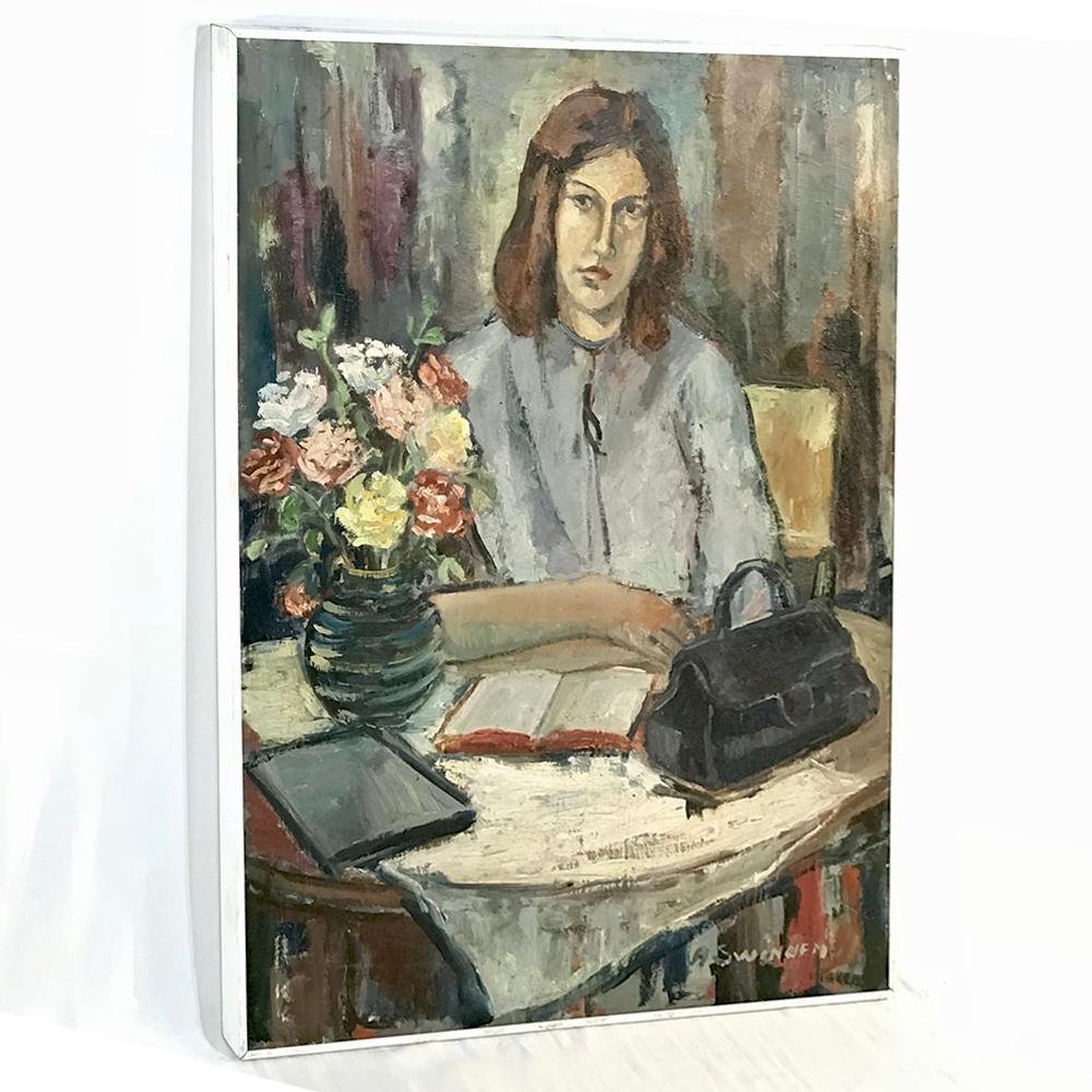 Modernist oil painting by A. Swinnen is simply framed and depicts an attractive young woman looking up from her reading, with a handbag and vase full of flowers for visual intrigue in the foreground,
circa 1960s
Measures: 38 H x 28 W overall.