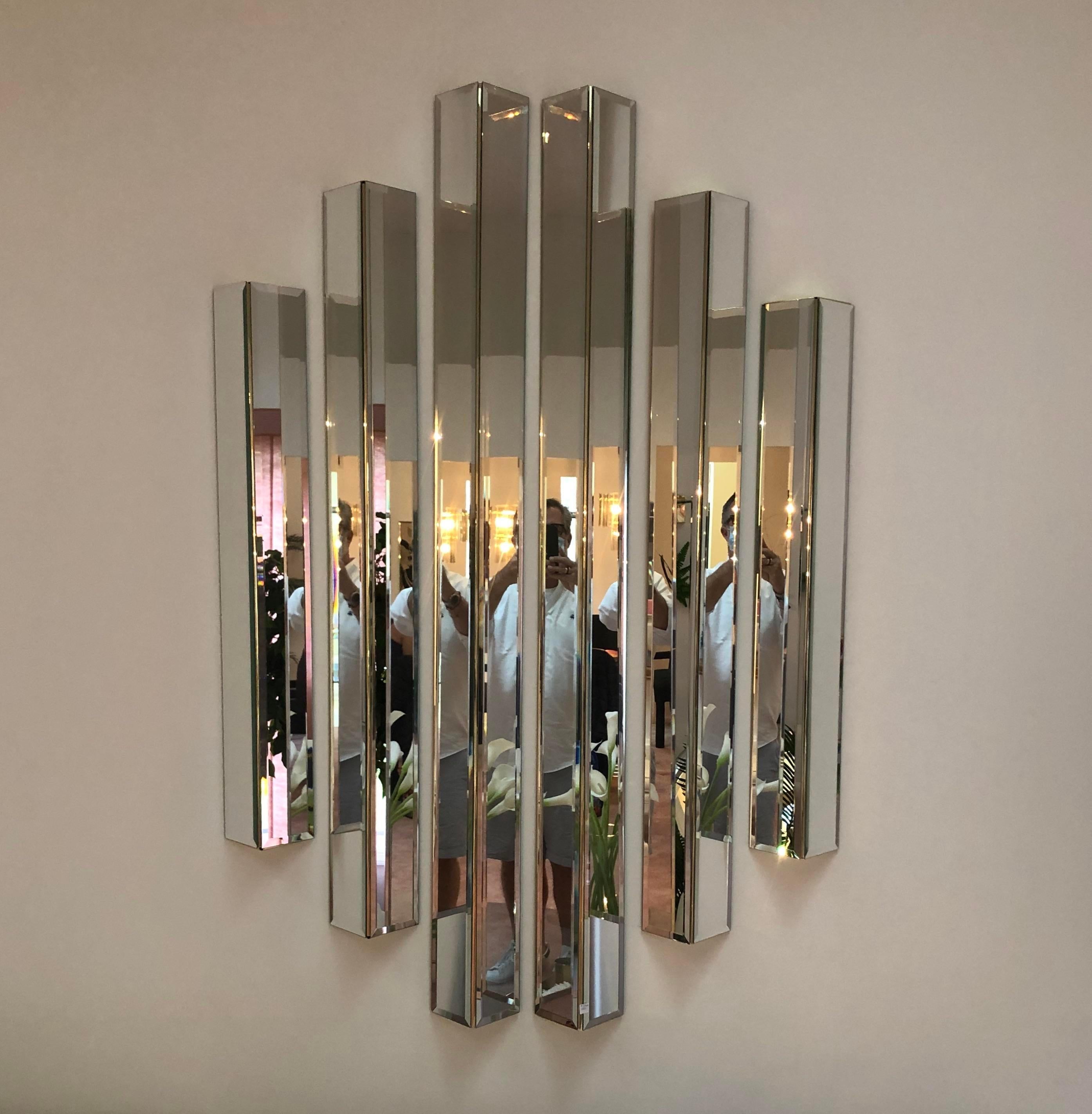 Very Unique example of modernist design. 6 triangular prism panels that add intrigue to any setting. Beveled mirror panels on 2 sides adds visual interest in reflection and cast incredible light. Gold cardboard forms hold to hold the