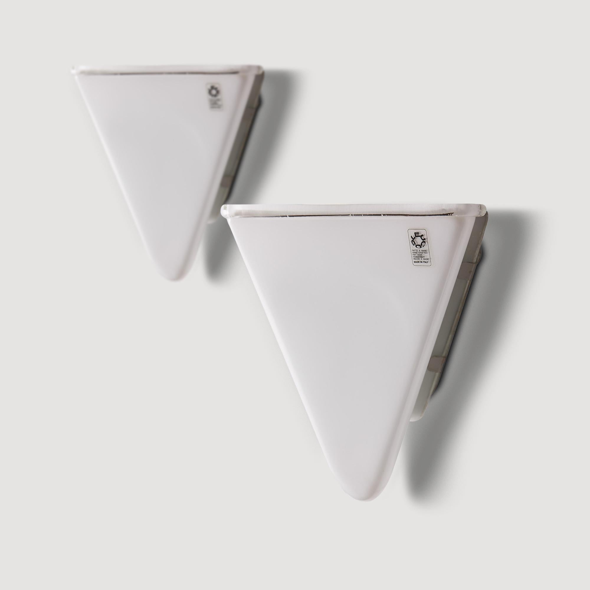A pair of Italian glass modernist wall lights by Leucos, in opaline glass, 1980s.