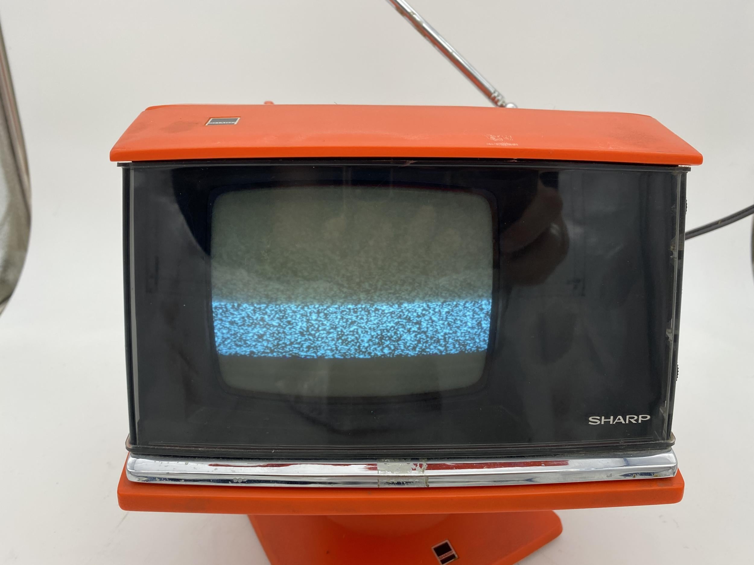 Modernist Space Age sharp television, model 3S-111 R..JAPAN, circa 1970. Amazing design, tested and in wonderful working condition

Note: The TV detaches from the base (which holds the transformer/power) and the chrome bar presses in to release to