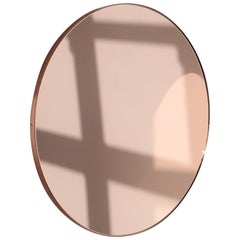 Miroir moderne rond Orbis teinté or rose/pêche avec cadre en cuivre, standard