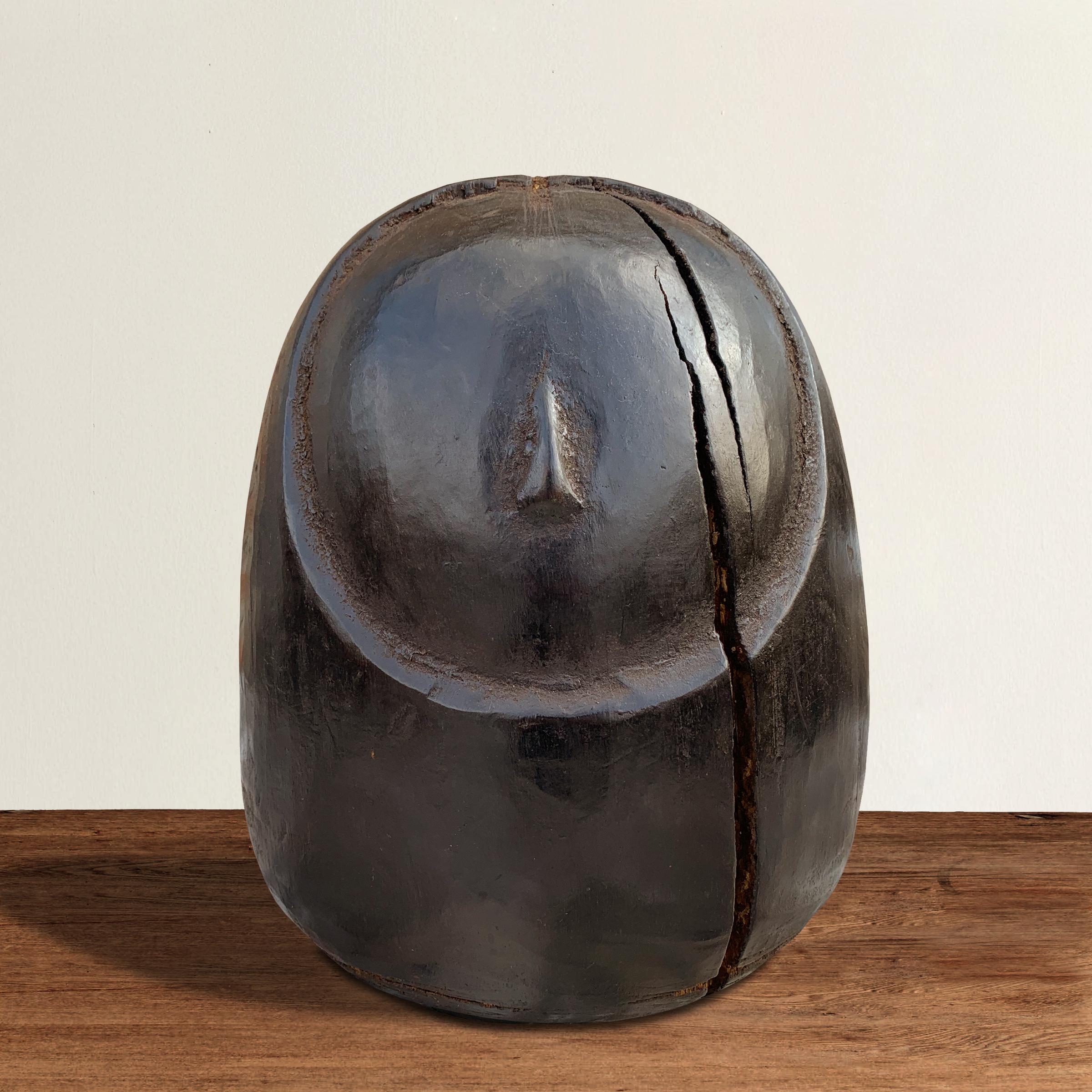A whimsical 20th century Thai carved wooden abstract owl originally used as a mold to make papier mâché sculptures, now a chic modernist sculpture. Knife marks down the back show where the hundreds of paper sculptures were cut off the mold.
