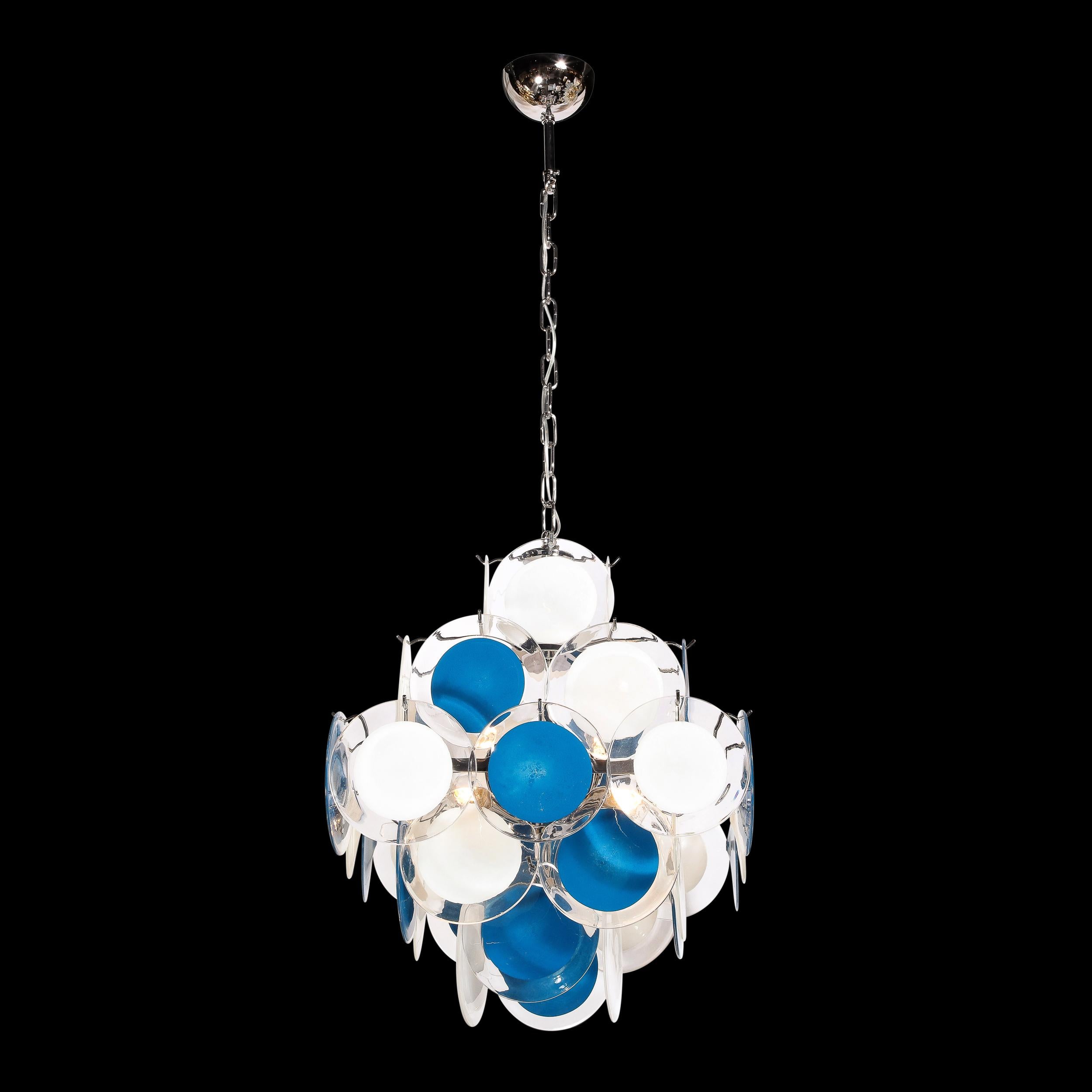 This stunning modernist pagoda style chandelier was realized in Murano, Italy- the island off the coast of Venice renowned for centuries for its superlative glass production. It features a pagoda style form that is widest at its midsection, and