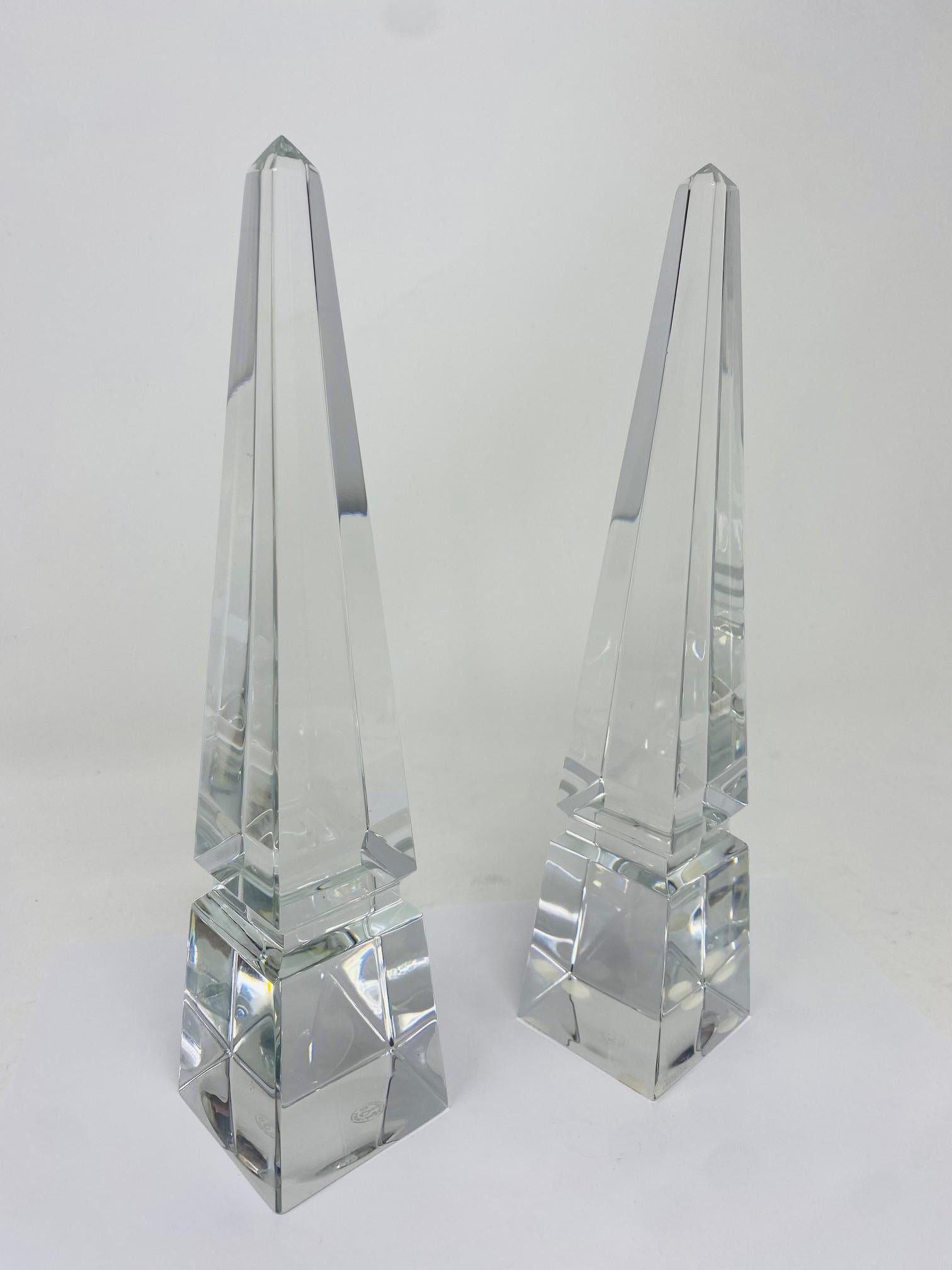
Incredible and stunning Baccarat Louxor crystal obelisks in near mint condition. Great pieces as a gift or to complement with any art glass collection. The pair exhibits the Baccarat stamp and seal on the bottom for authenticity.  The sculptural