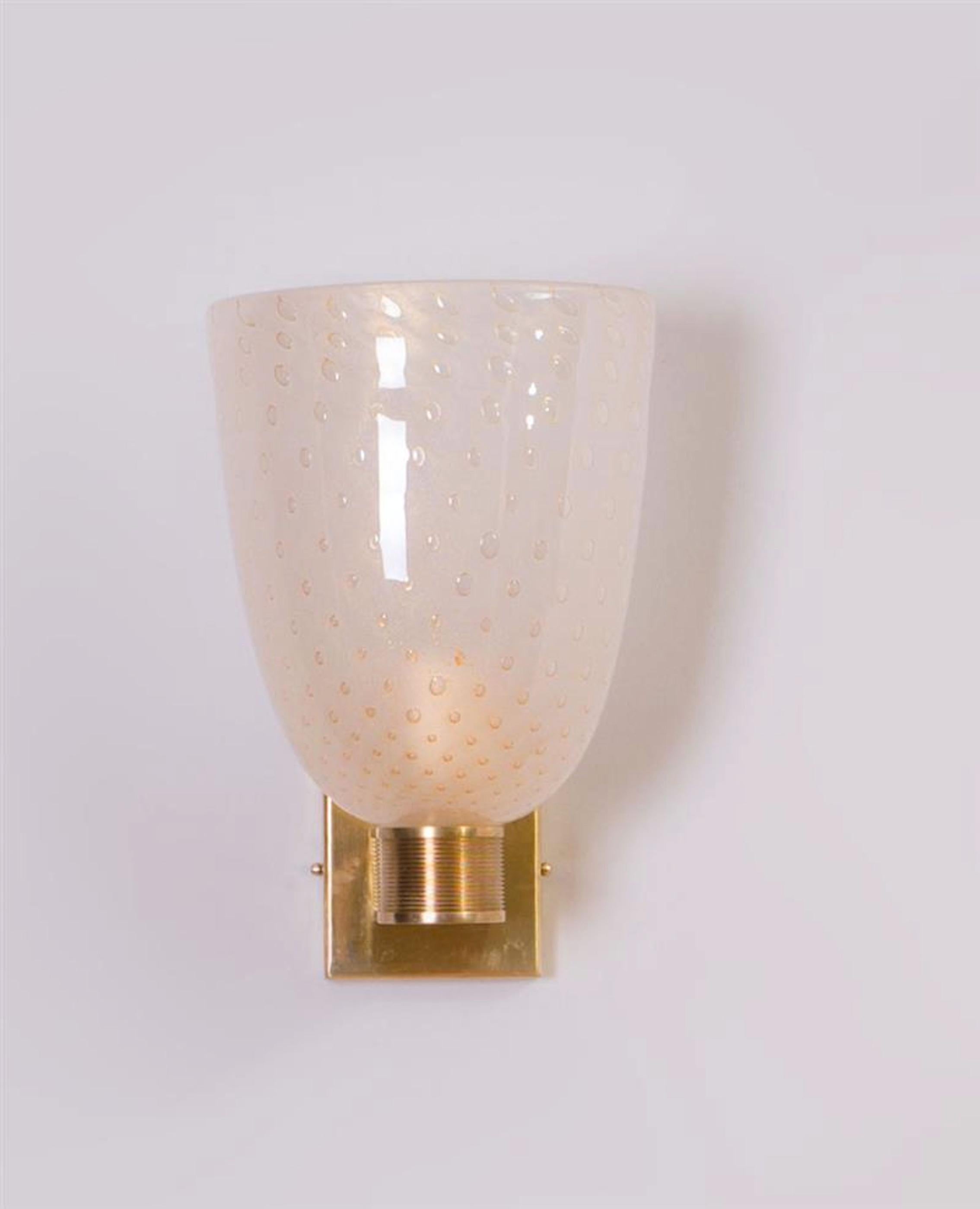 Modernist pair of brass mounted Murano glass sconces,






 