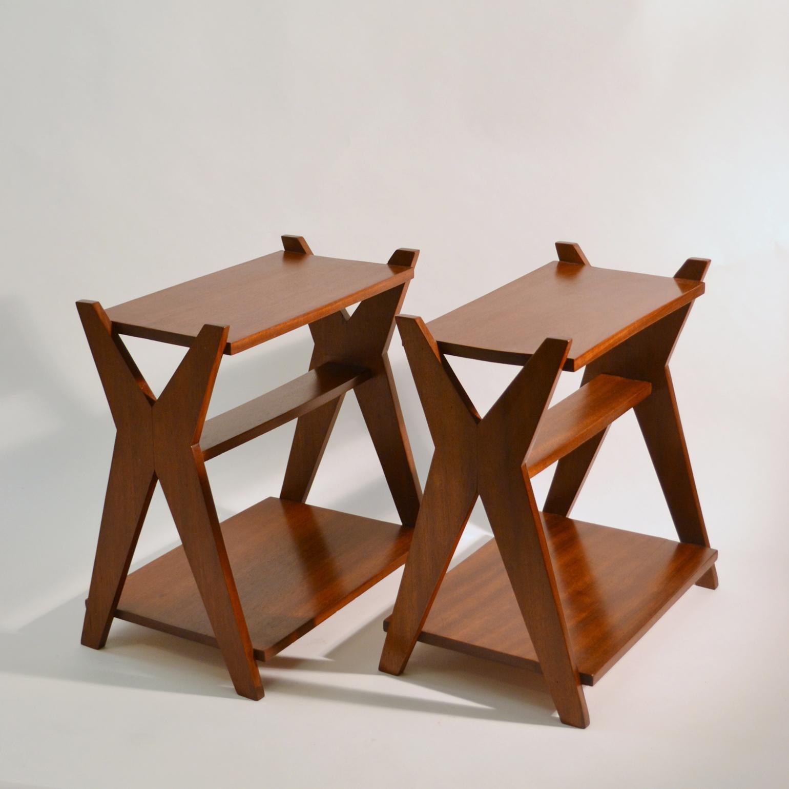 French 1930s pair modernist side tables with three level surfaces in different sizes and cross legs in solid re-polished mahogany.
 