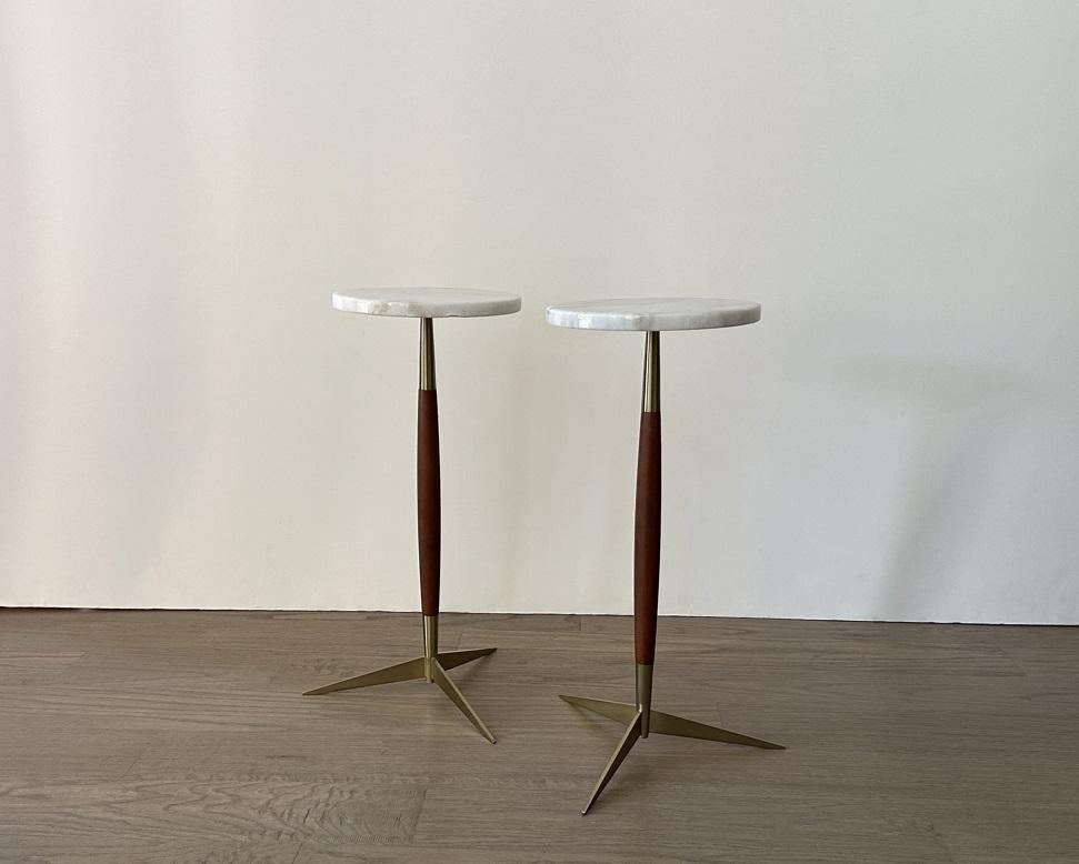 Decorate a den or living room with this striking pair of side or drink tables from the late 20th century. In the likes of Paul McCobb for Thonet and George Nelson & Associates for Herman Miller. Each minimalist side table features a round white and