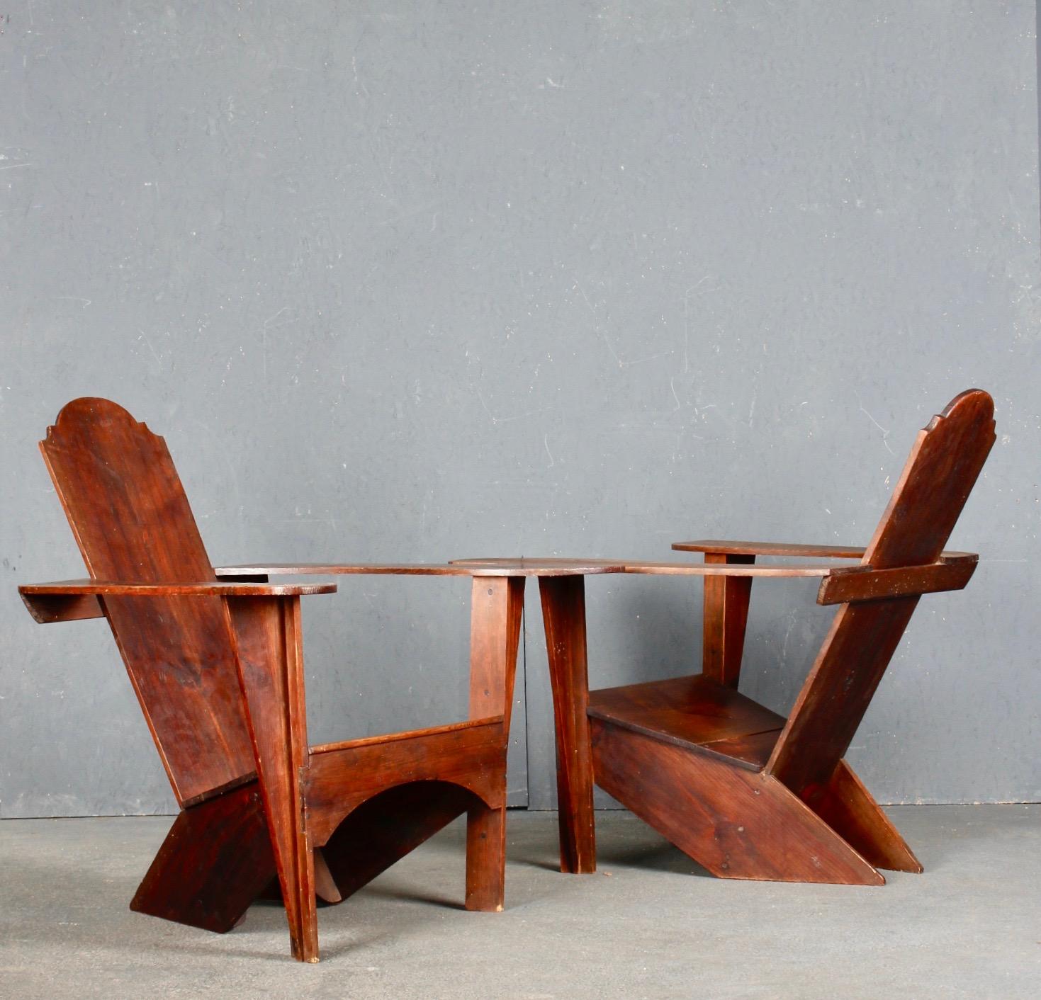 Modernist pair of wood sculpture armchairs.