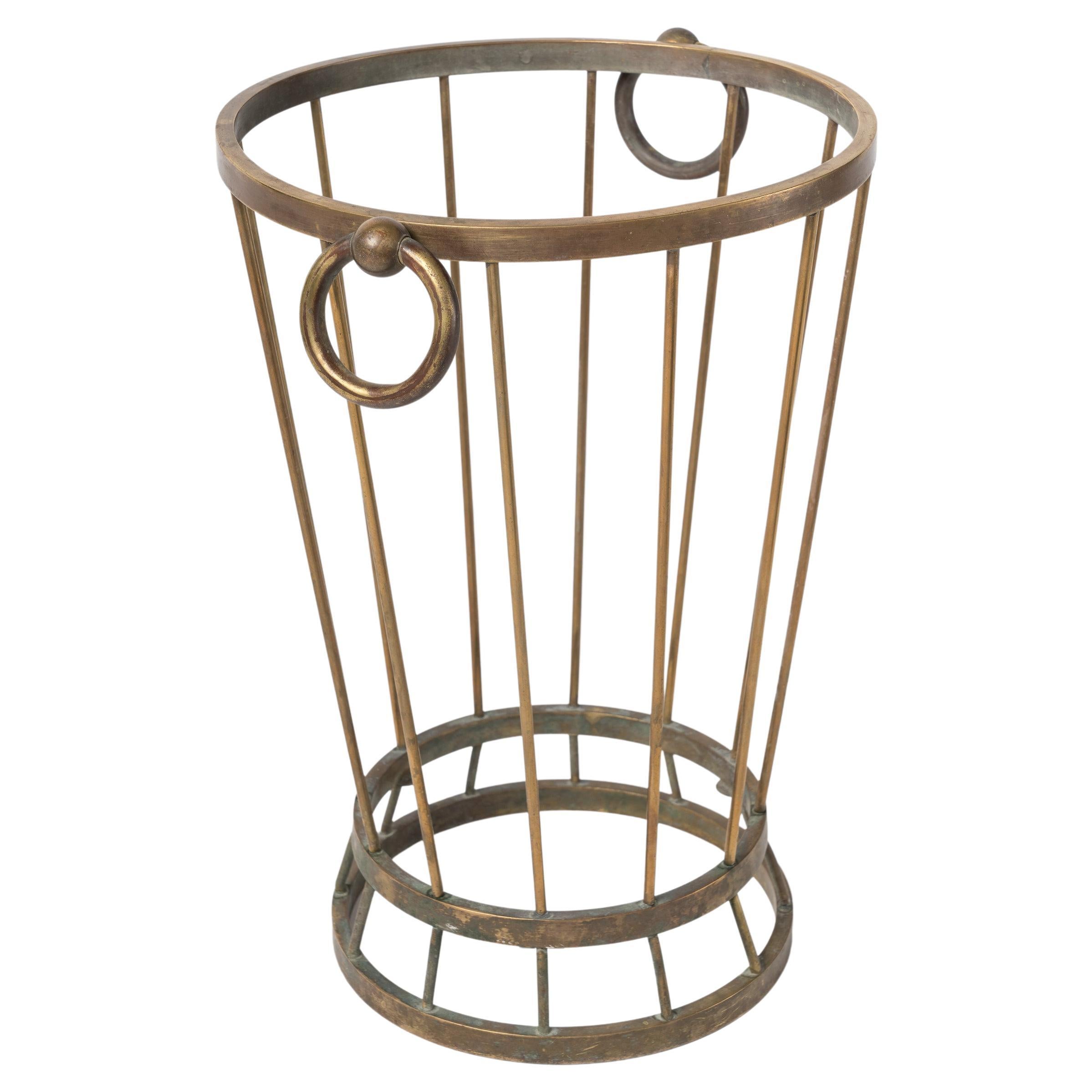 Elegant modernist umbrella stand made of patinated brass. In the style of Royere.
This stand will ship from France and can be returned to either France or to a LIC NY location.
Price does not include shipping nor possible customs duties related