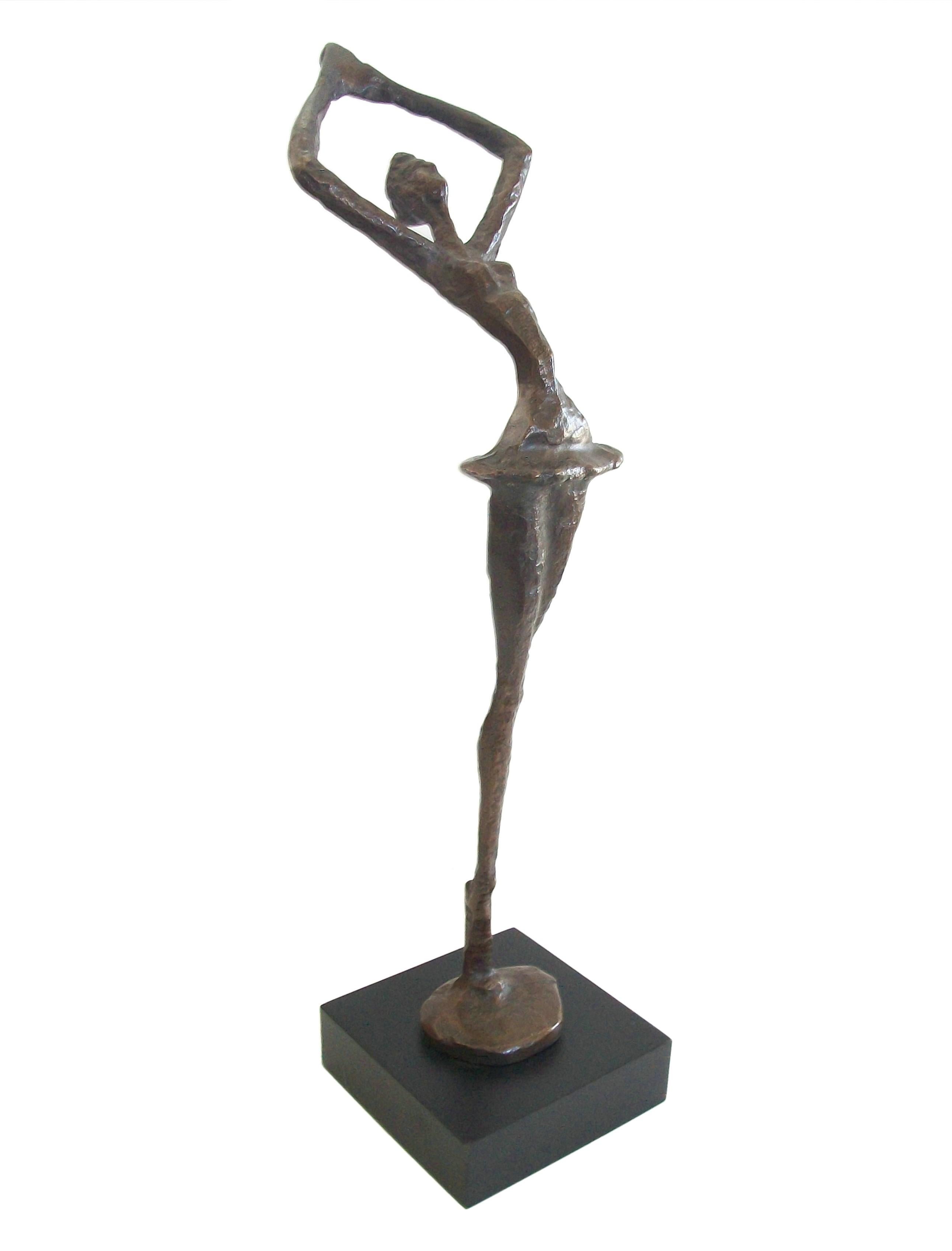 Modernist patinated bronze Ballerina sculpture on ebonized wood plinth - decorative quality - tabletop placement - unsigned - United States - circa 1980's.

Excellent vintage condition - all original - no loss - no damage - no repairs - minor