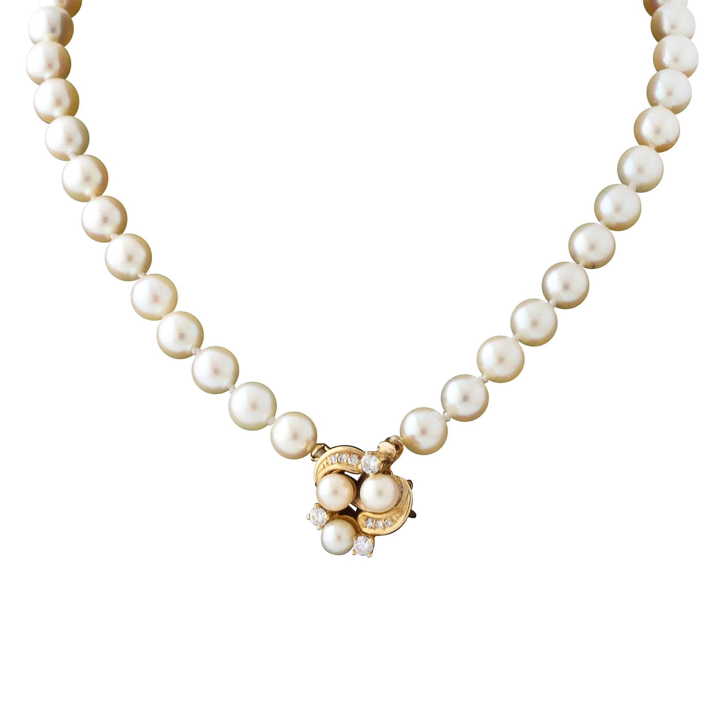 This classic and elegant pearl necklace features 56  6mm pearls set with a clasp in 14k yellow gold set with 9 brilliant cut diamonds and 3 pearls . A perfect bridal gift. The clasp can be worn in the front or the back changing the look of this