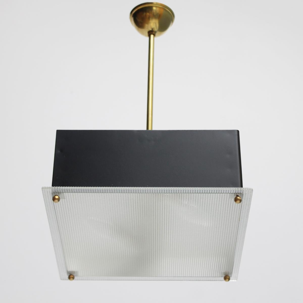 Small French Modernist hanging lamp by Maison Arlus, 1950s. Beautiful and elegant 28 because of its simple shape. Black lacquered metal with a glass top and brass details. Good condition.
Two bayonet bulbs (BA15d, IEC 7004-11 A, DIN 49720). The