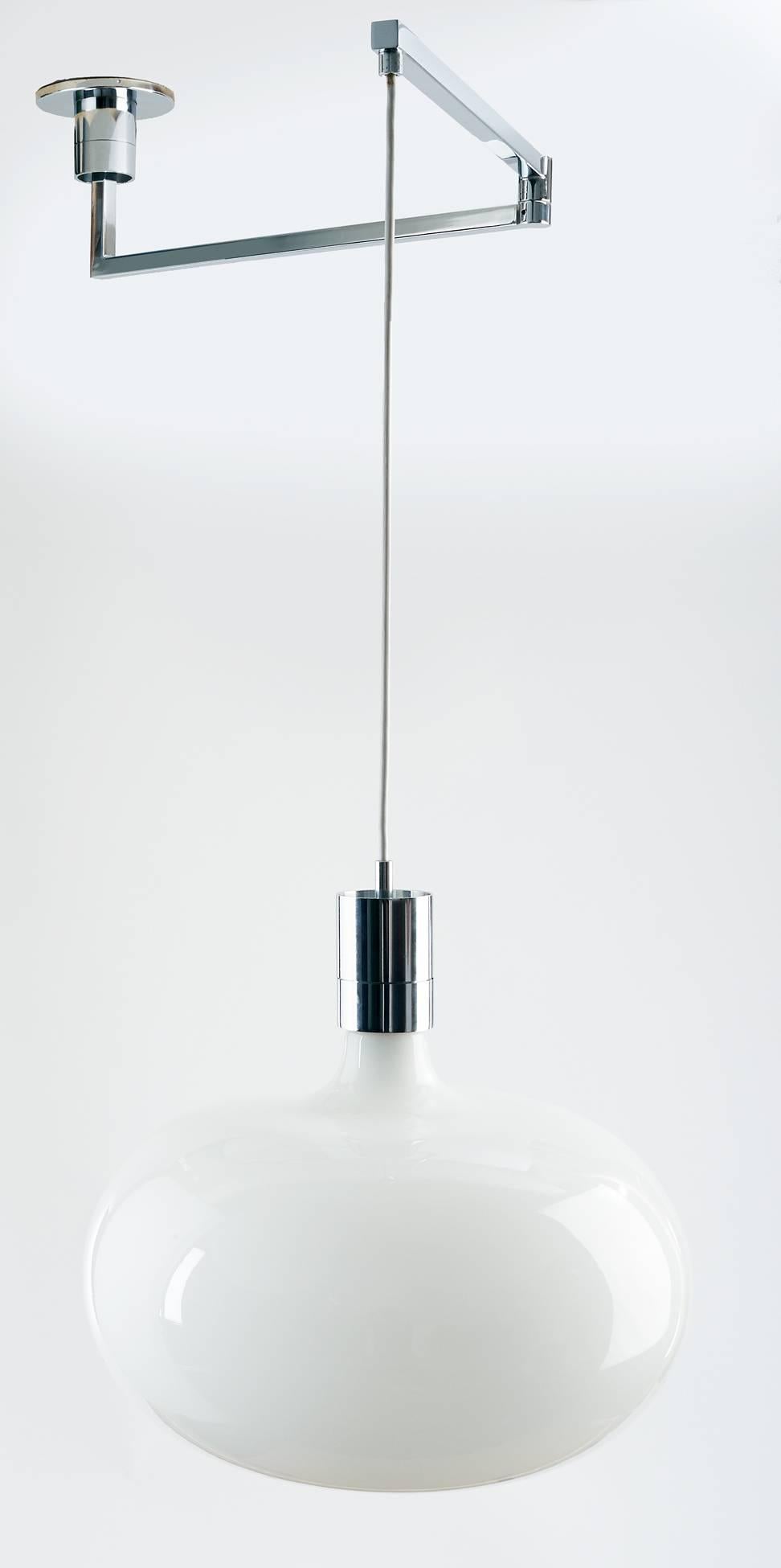 Franco Albini (1905–1977)

Minimalist, early model adjustable-height pendant by Franco Albini, with a movable chrome-plated swing-arm and a sleek, dimpled opaline glass shade. Height is adjustable; maximum height is 45 inches. 