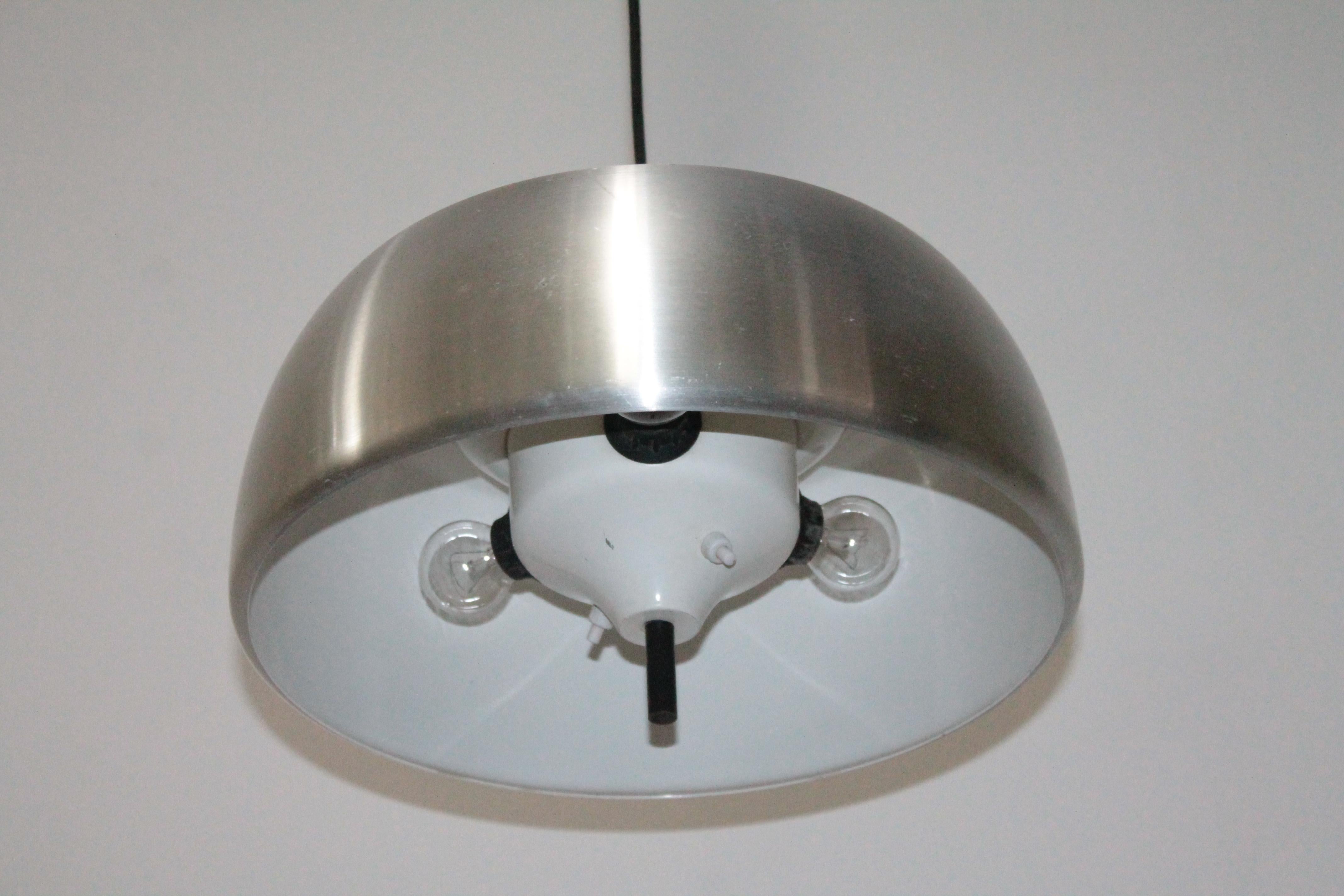 Rare pendant lamp produced by Lumi Milano design by Oscar Torlasco in 1960s, aluminum chandelier with power buttons inside to switch on the upper or lower part or both.
Height adjustable, original good condition.